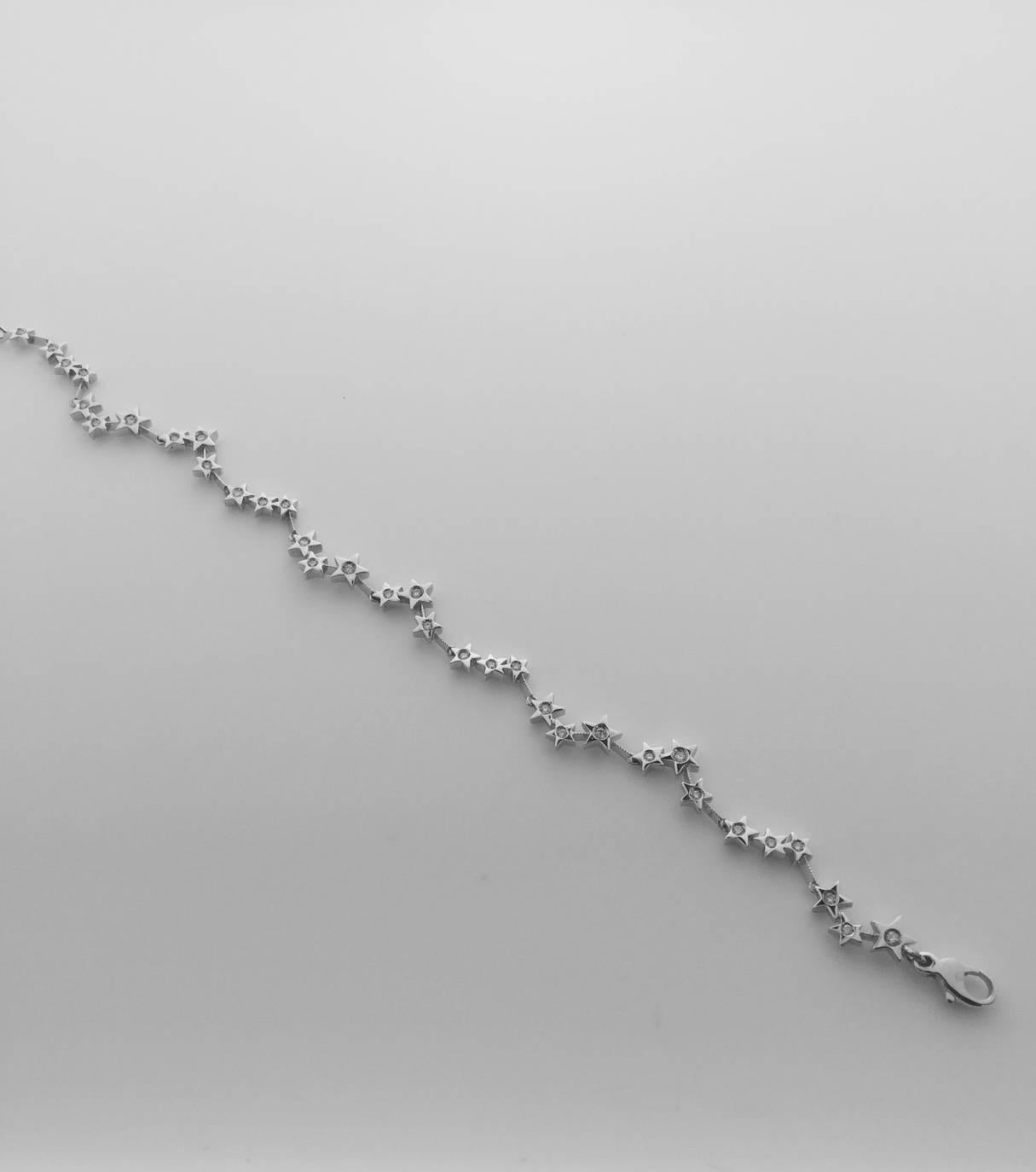 Whimsical 18k diamond bracelet containing 24 diamonds weighing combined 0.37 carat. 