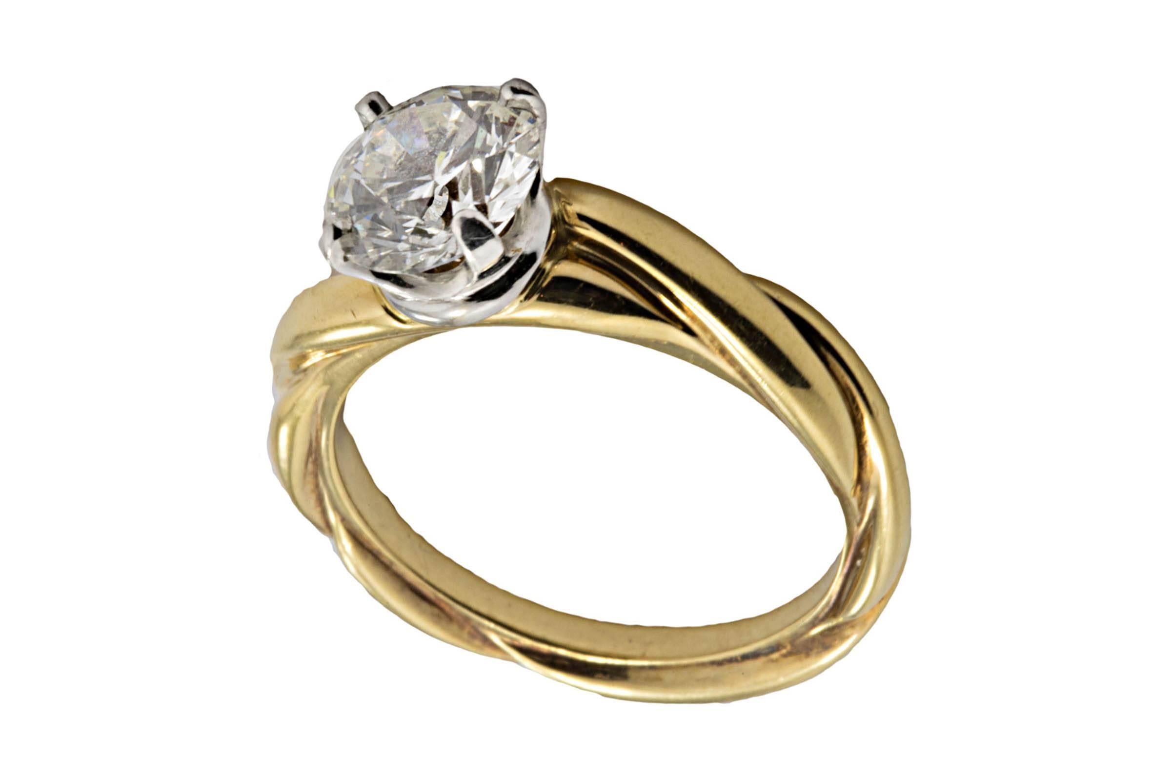 18K and Platinum ring containing an ideal cut diamond weighing 1.29 carat, J color, VS1 clarity.
Size 5 1/2. Can be sized.