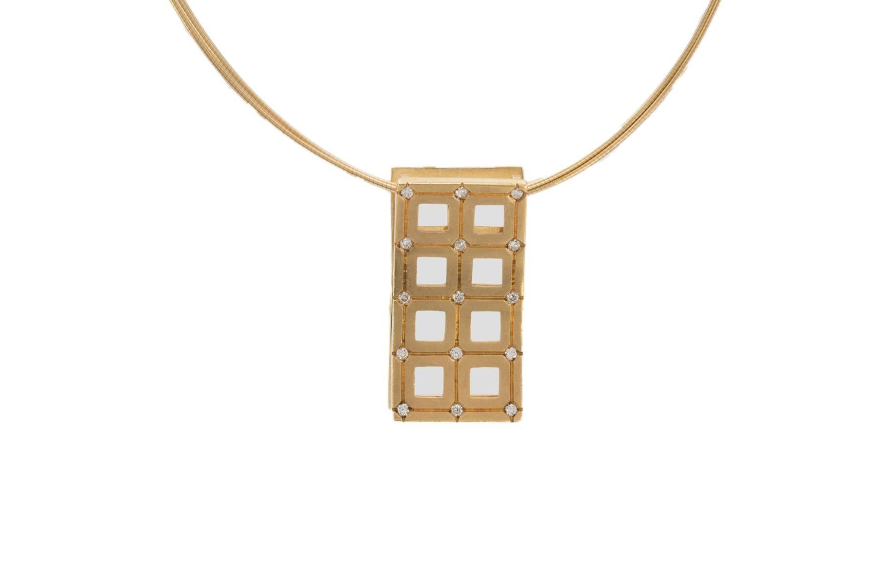 18K yellow gold rectangular concave diamond slide pendant containing 15 diamonds weighing combined 0.23 carat.
The slide is shown here on a triple strand 18K round omega with barrel clasp that is 17