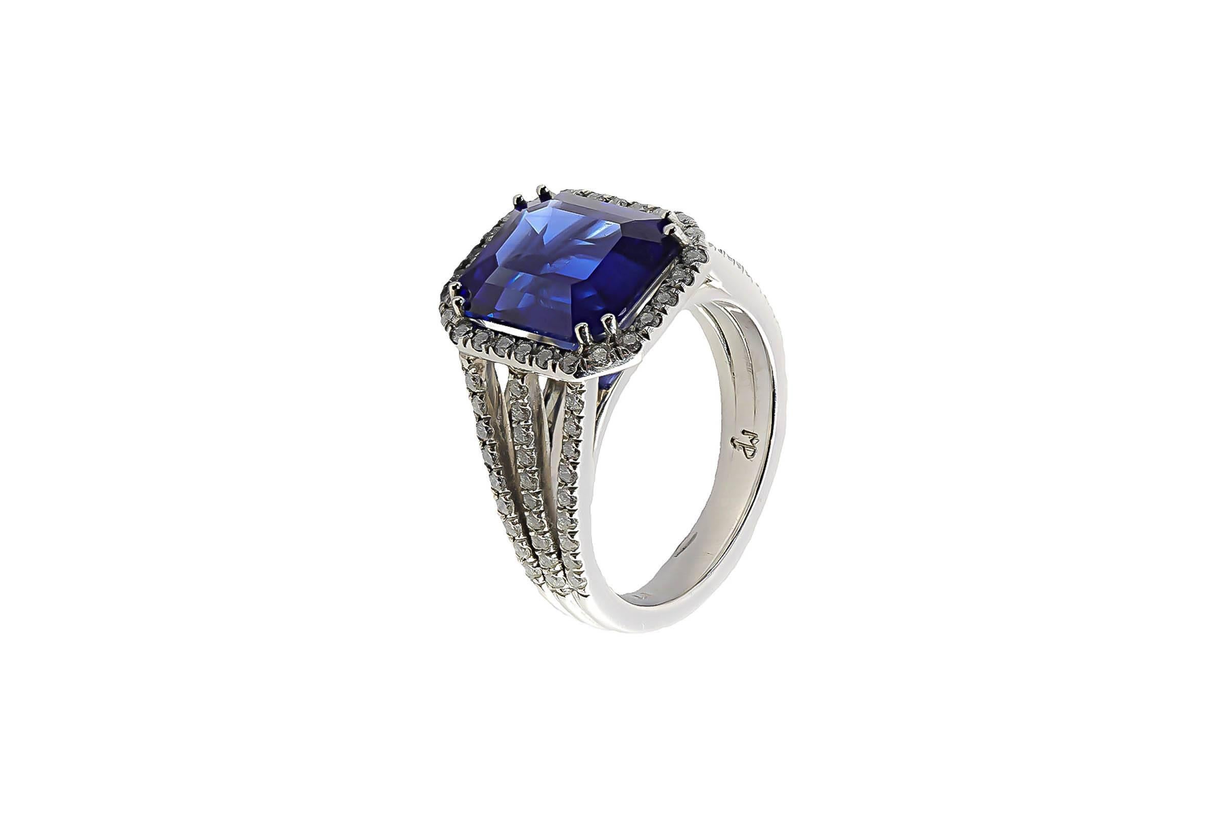 Platinum ring containing one emerald cut sapphire weighing 5.53 carats. The mounting contains 82 micro pave set diamonds weighing combined 0.59 carat, G color, VS clarity.
Size 6. Can be sized.
