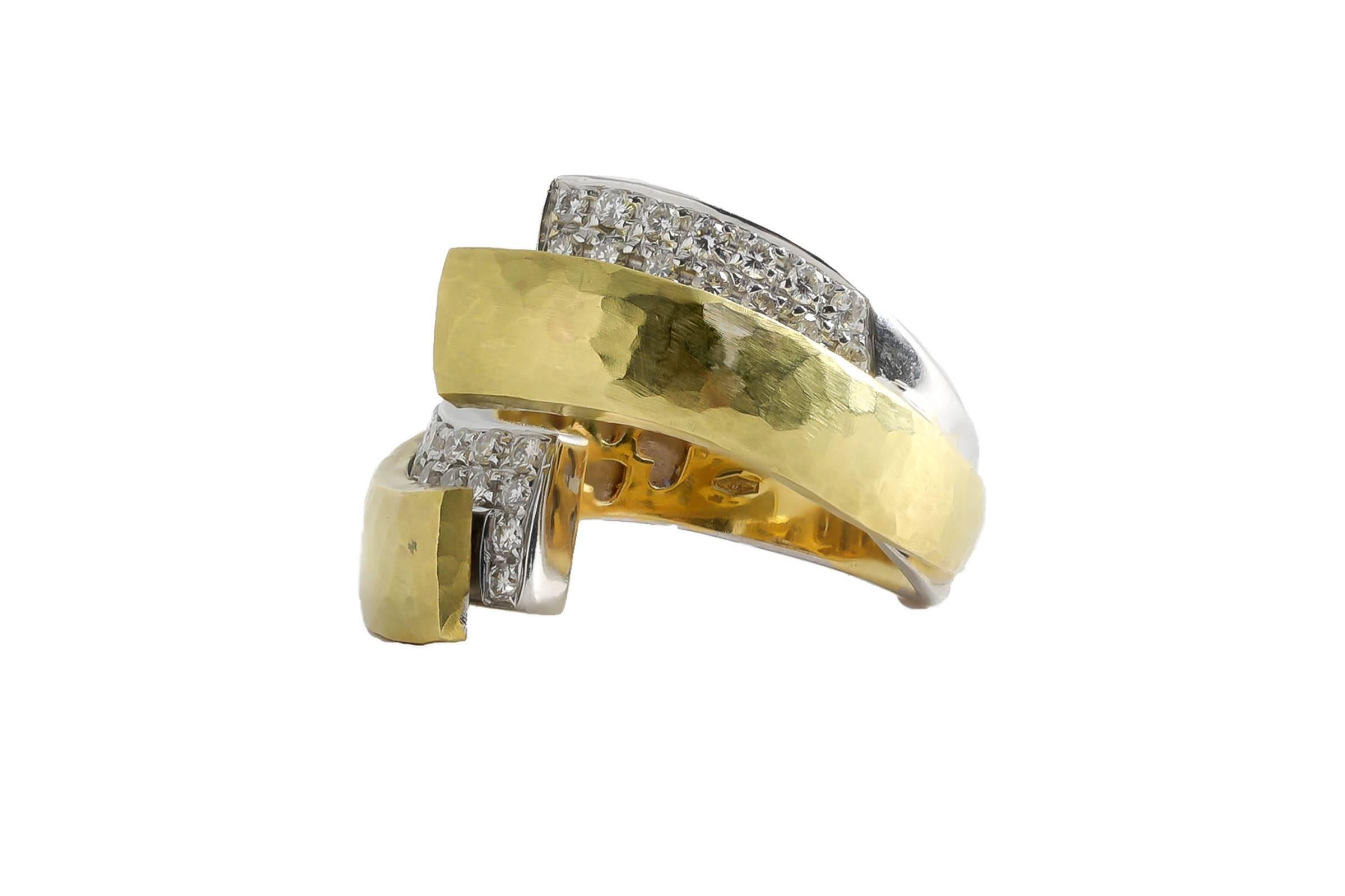 18K gold hammered finish ring containing one carat of pave set diamonds.
Can be sized.