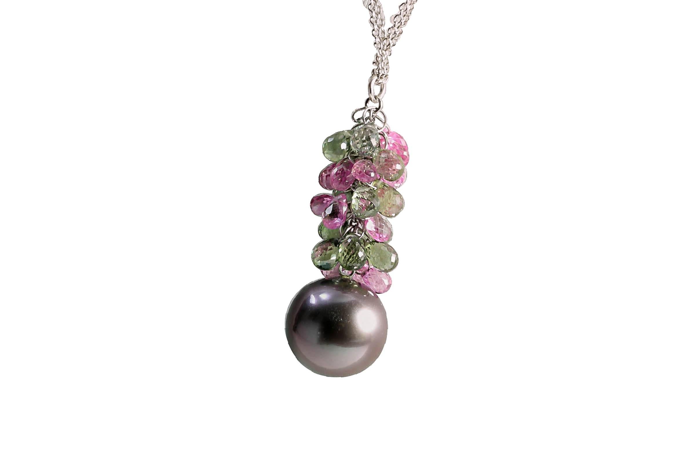 18K white gold double chain necklace with a 12 mm cultured black pearl and semi-precious briolettes pendant.
The chain is 16 1/2  long and the pendant is 1 1/4 long.