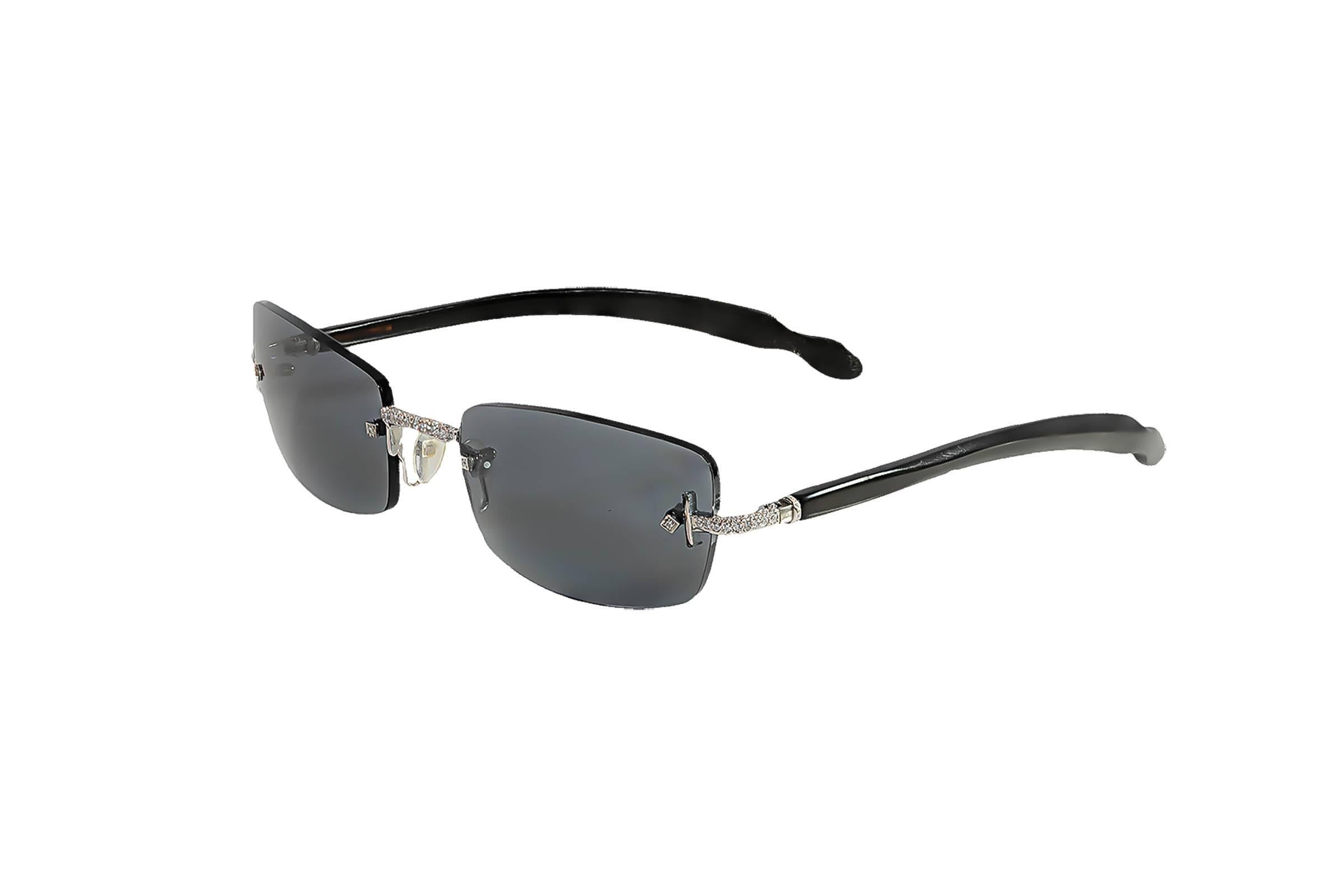 A very unique piece of jewelry: Sunglasses. Luxuriator by Franco are the glasses of the rich and famous. The metal on these glasses is 18K white gold and they contain 1.20 carats of diamonds, F-G color, VS clarity.