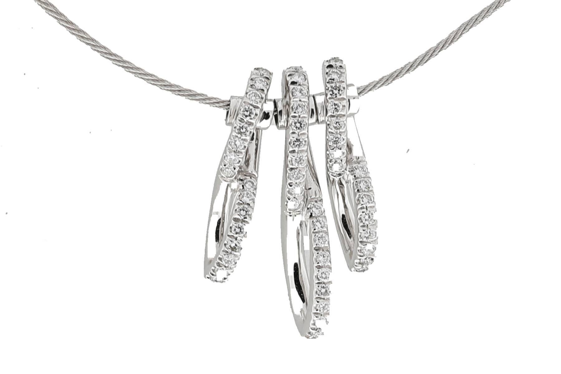 18K cable necklace with 3 figure eight design sliding pendants containing pave set diamonds weighing combined 0.60 carat.