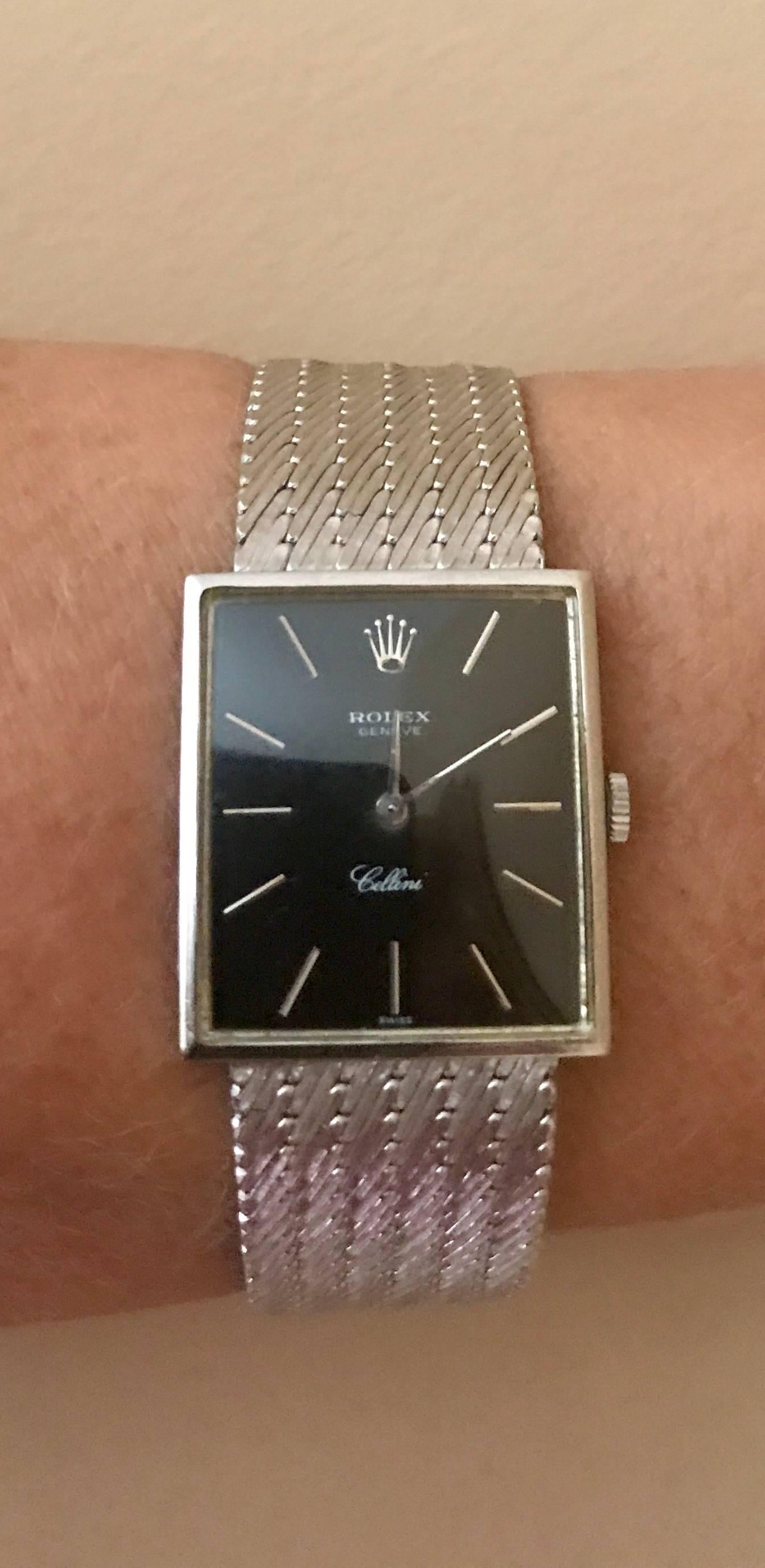 Estate piece.  18K white gold mechanical Rolex Cellini watch with with fold over clasp. Black dial. This watch is unisex and will fit a woman or a man with a smaller wrist. Wrist size approximately 6 3/4