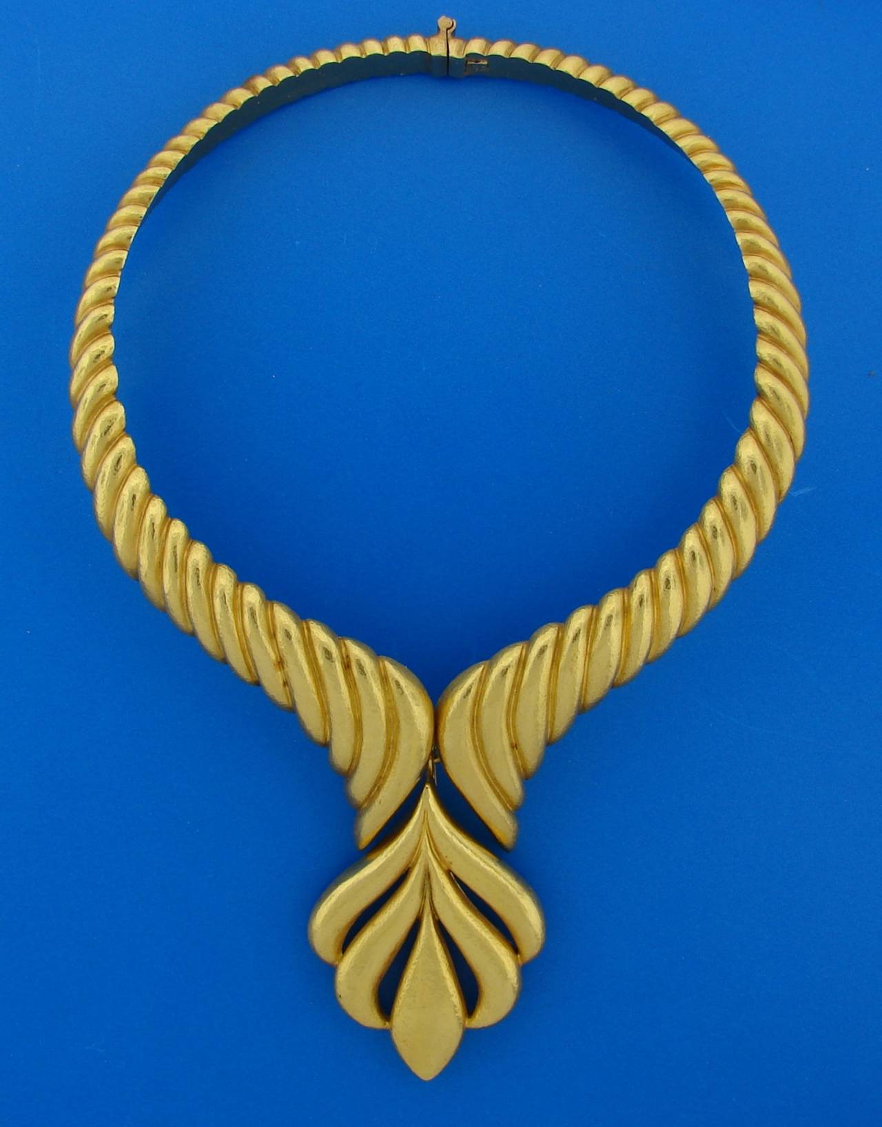 Stunning 22 karat yellow gold choker necklace created by a Greek jewelry designer Zolotas in the 1980's. It is bold yet very elegant, versatile and wearable. The pendant is removable and you can play with it putting it on a color leather or velvet