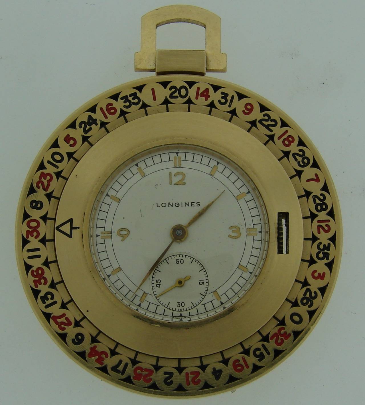 Have Las Vegas in your pocket! - stunning pocket watch made as a roulette. The outer circle with numbers is turning! You can gamble anywhere anytime! 
Made of 14K (tested) yellow gold and enamel. 
Measurements: 1-5/8 inches diameter; the height with