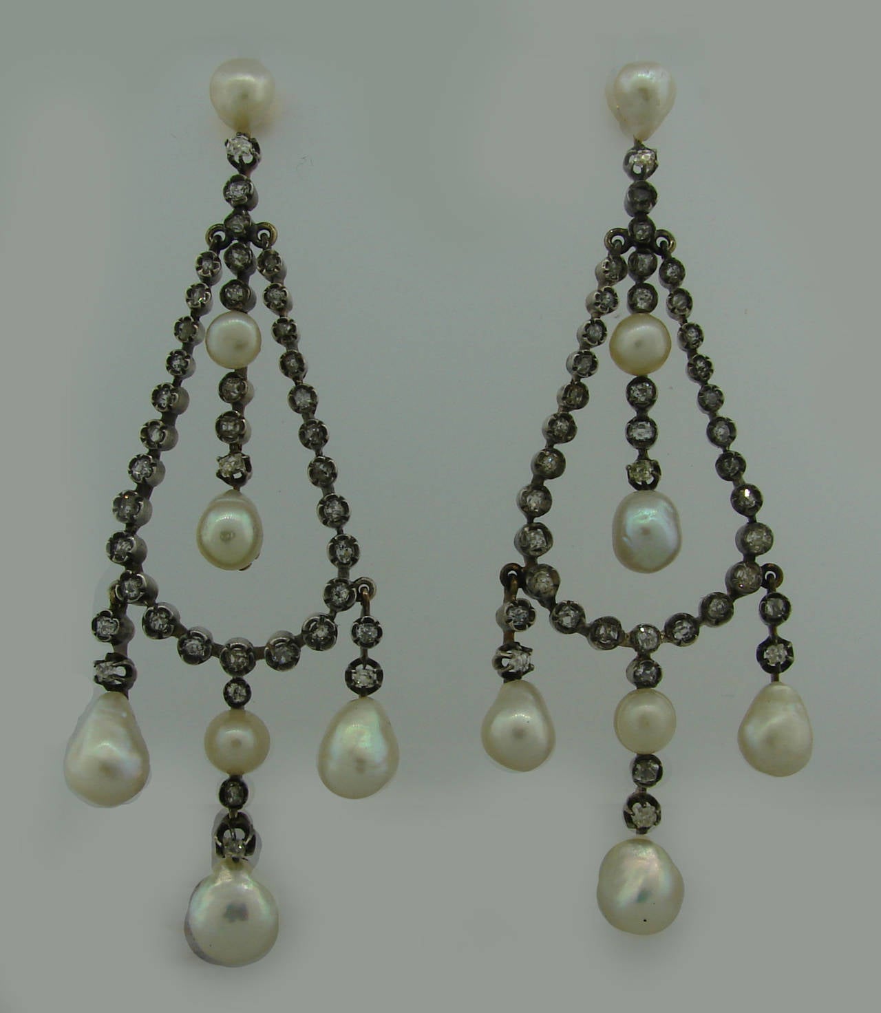 Magnificent antique Victorian earrings! From Fred Leighton Collection. Featuring fourteen natural saltwater pearls ranging from 5.24 mm to 8.85 mm - they come with a GIA natural Pearl Identification Report. The earrings are made of silver and yellow