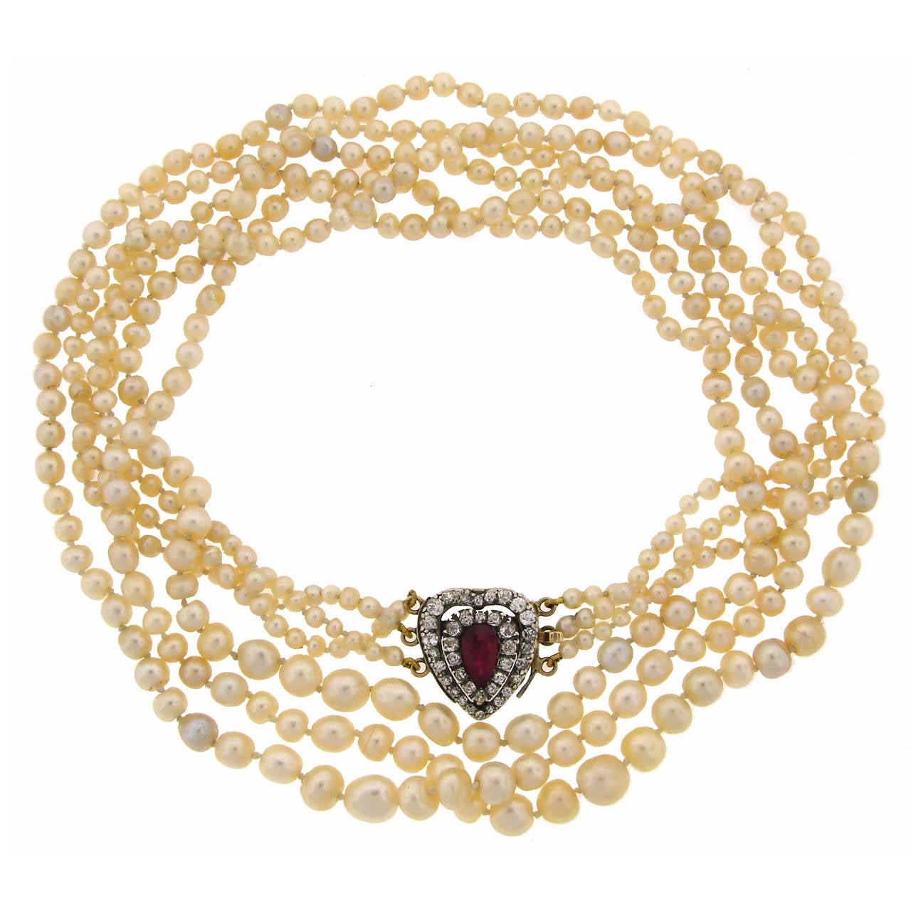 Victorian natural pearl necklace with a gorgeous clasp. Features three strands of natural pearls culminating with a diamond clasp set in platinum and yellow gold. The pearls come with a certificate from Gemological Certification Services London UK