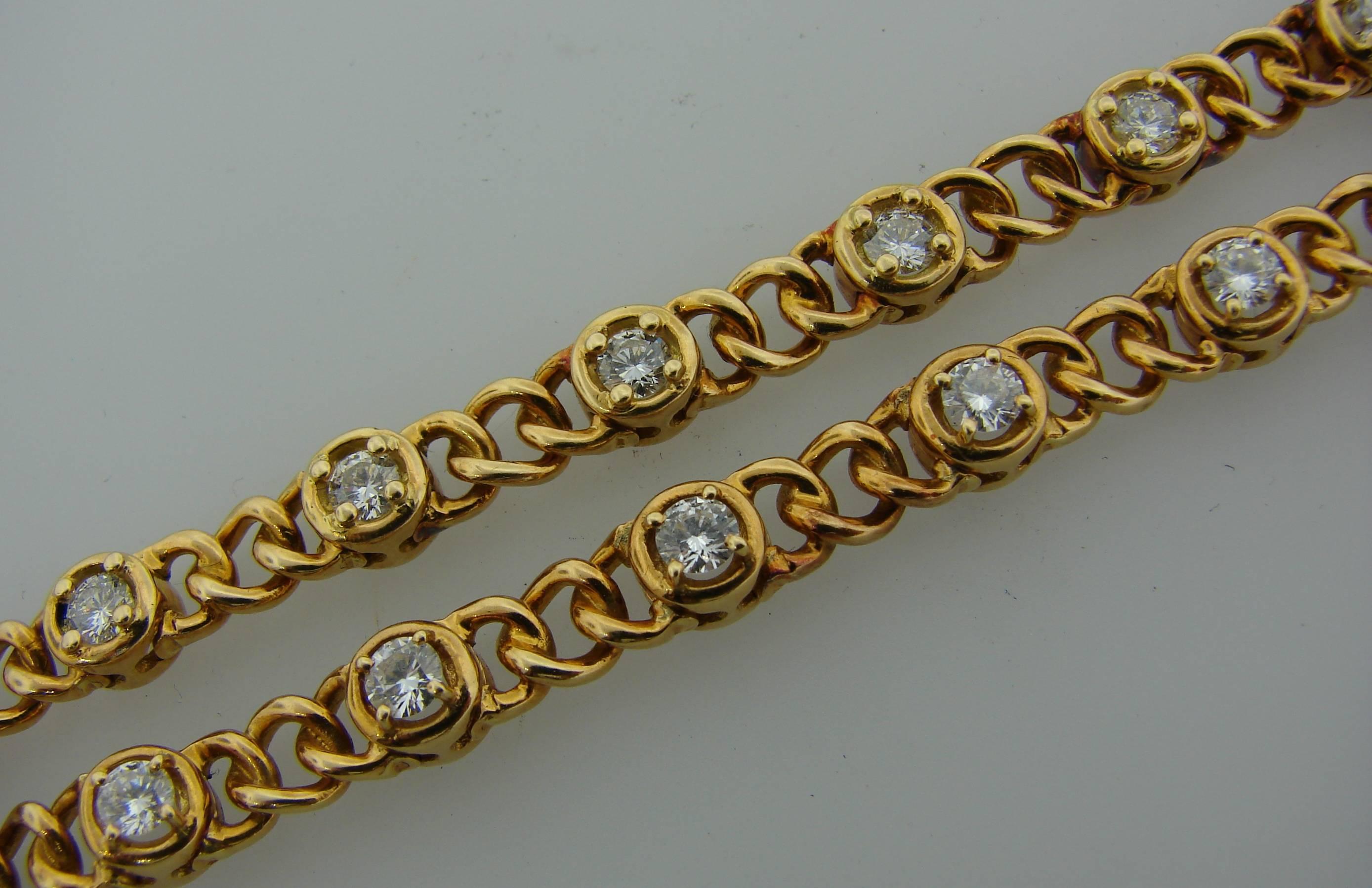 Feminine wearable pair of bracelets created by Van Cleef & Arpels in France in the 1980's. It is made of 18k yellow gold (French hallmarks for 18k gold) and set with twenty eight round brilliant cut diamonds. The diamonds are F color VS1 clarity,