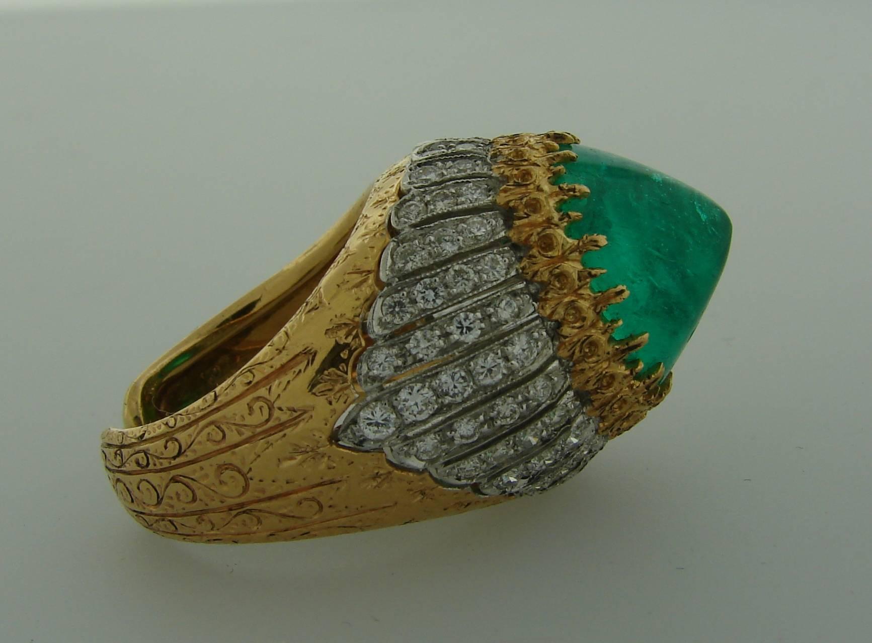 Stunning cocktail ring created by Buccellati in Italy in the 1970's. Features a gorgeous over 10-carat sugarloaf emerald set in 18k yellow gold and accented with 84 round brilliant cut diamonds set in 18k white gold. Beautiful detailed work on gold.