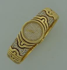 Bulgari Montre-bracelet à quartz Parentesi en or jaune et diamants pour femme