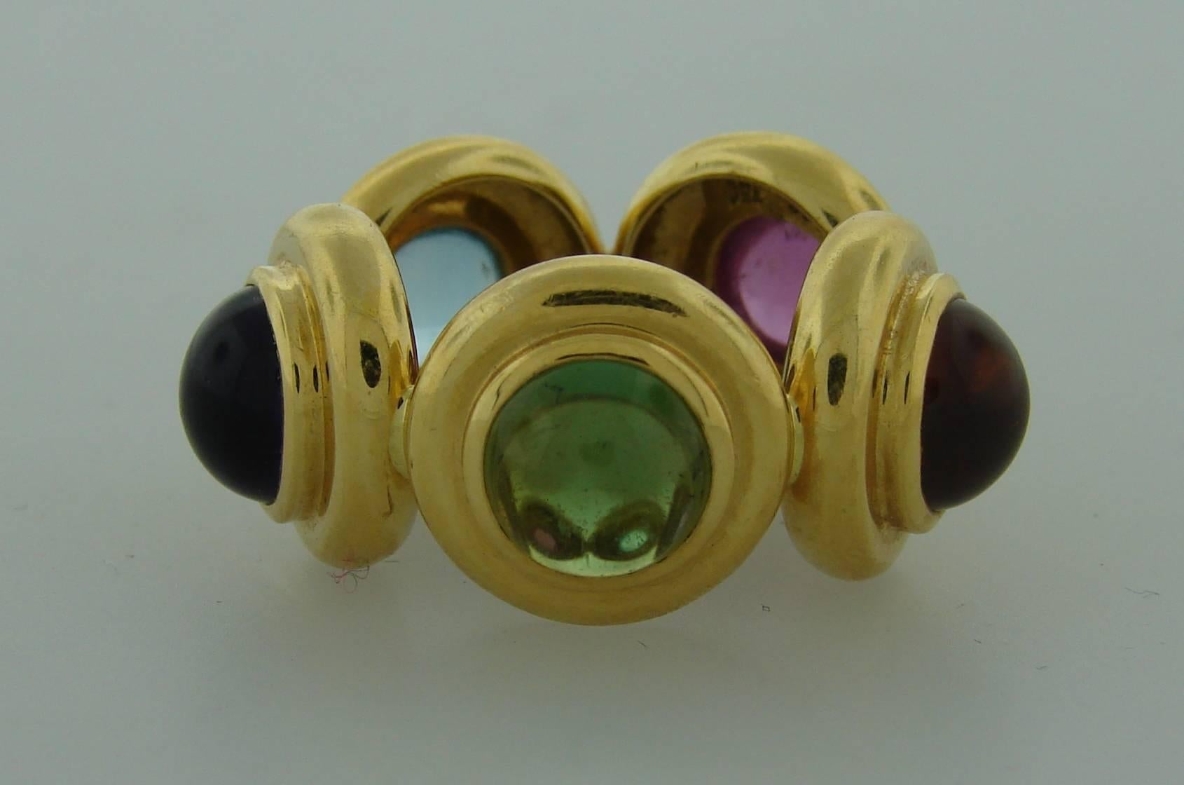 Chic colorful ring created by Paloma Picasso for Tiffany & Co. Made of 18k yellow gold and set with cabochon peridot, amethyst, aquamarine, rubelite, citrine. 
The ring is size 6.
It is stamped with Tiffany & Co. and Paloma Picasso maker's marks