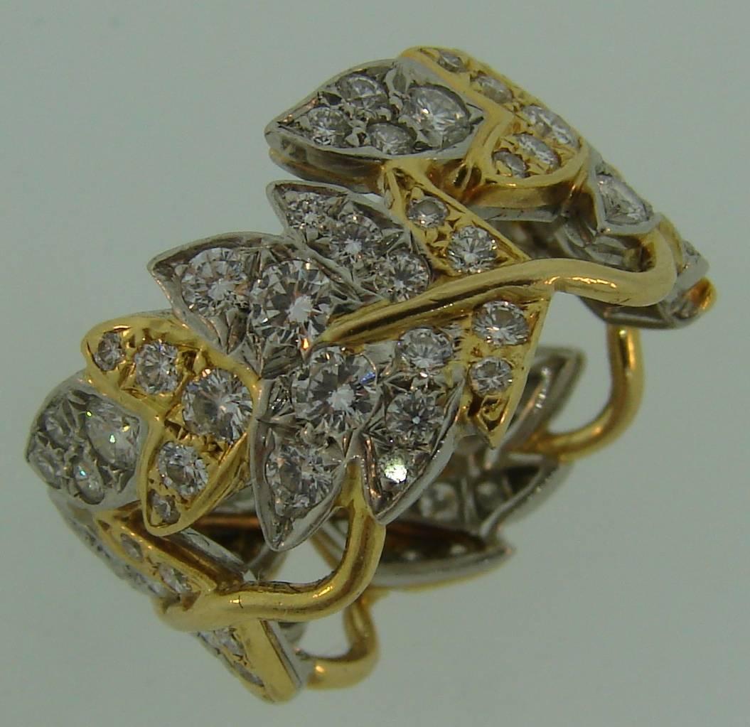 Timeless and elegant ring created by Jean Schlumberger for Tiffany & Co. Lovely floral design, gracious lines, perfect proportions. It is a great addition to your jewelry collection. The ring is made of 18 karat yellow gold and platinum and set with