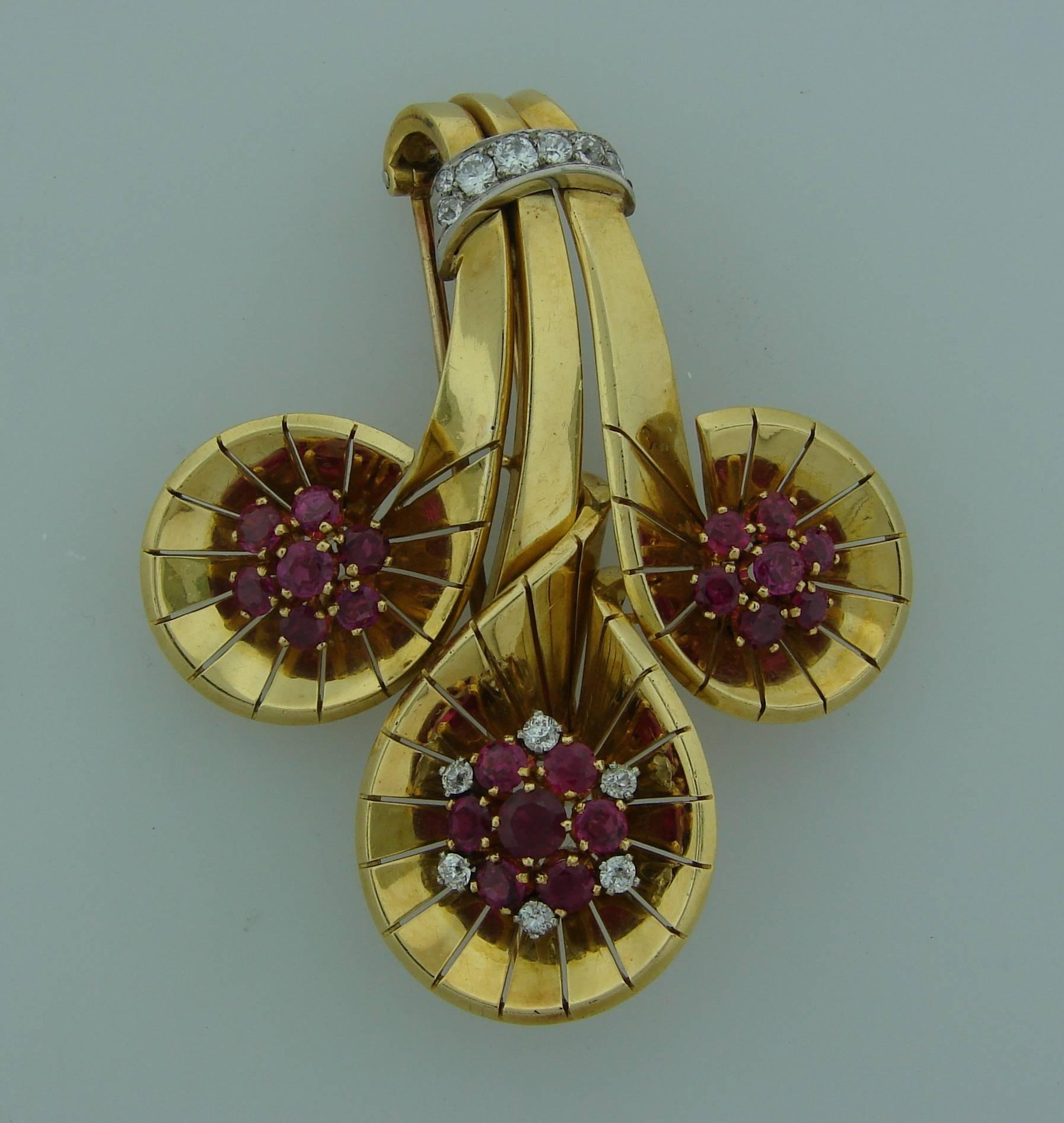 Chic and timeless clip created by Cartier in 1942. Definitely a conversational piece that would make a great addition to your jewelry collection.
The clip is made of 18 karat (stamped) yellow gold and encrusted with rubies and diamonds. The rubies