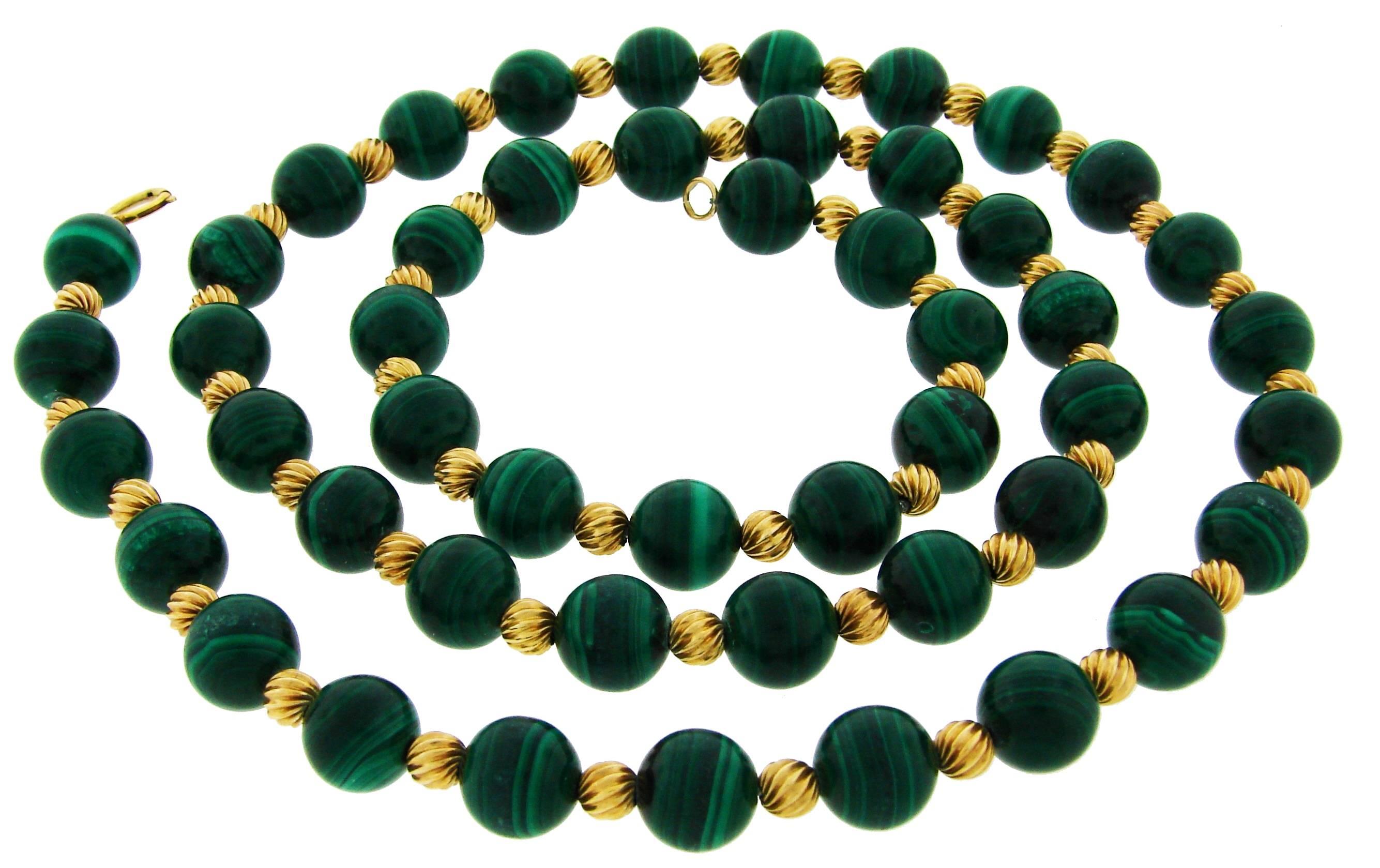 Lovely colorful necklace created by Van Cleef & Arpels in the 1970's.
Beautiful combination of green malachite and golden beads - green meadows meets the sun! 
The malachite beads are 3/8