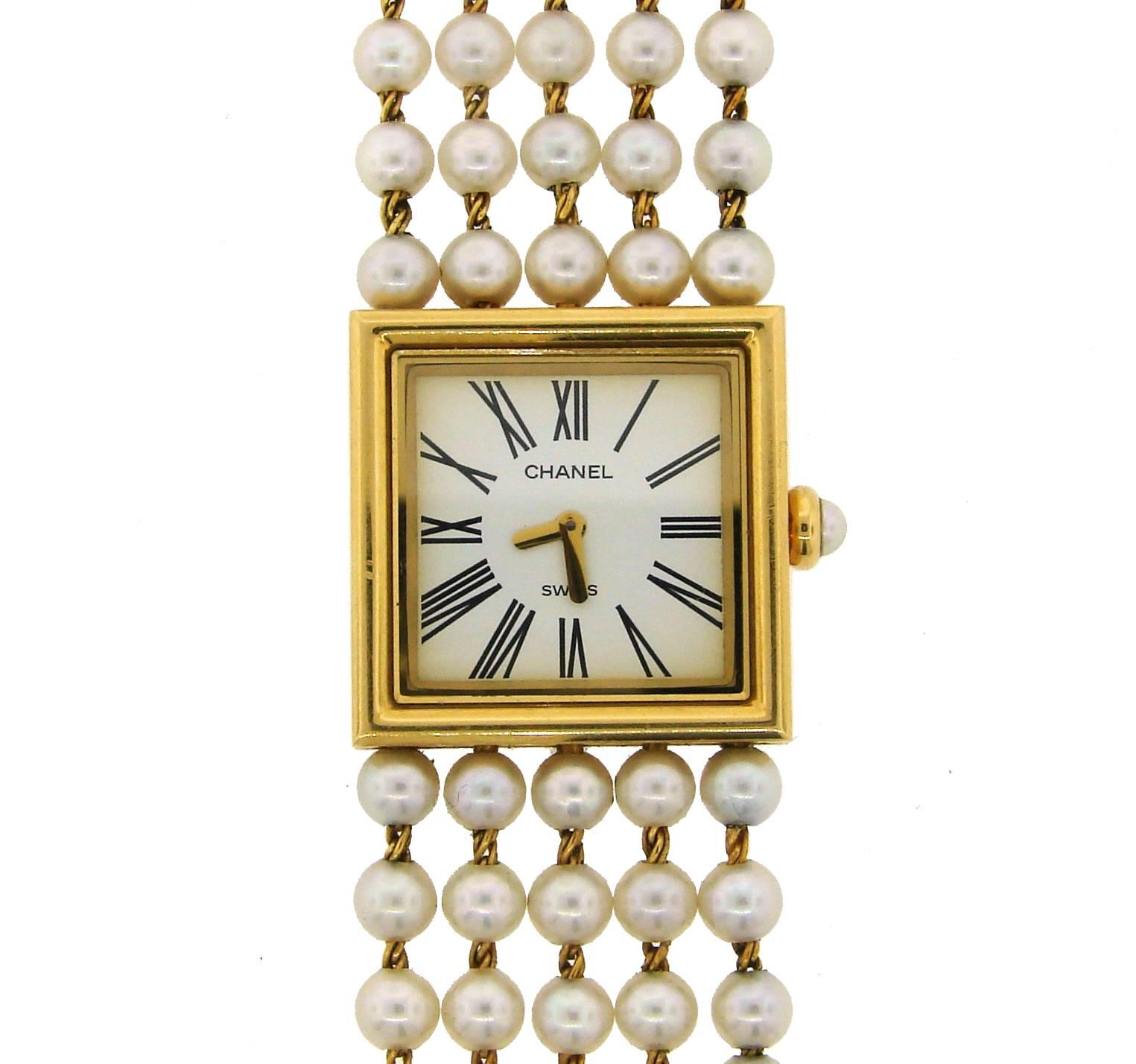 Chic Chanel watch/bracelet created in 1989. Classy and feminine piece! Very Chanel! 
It is made of 18 karat yellow gold and pearl.
The face measures 7/8
