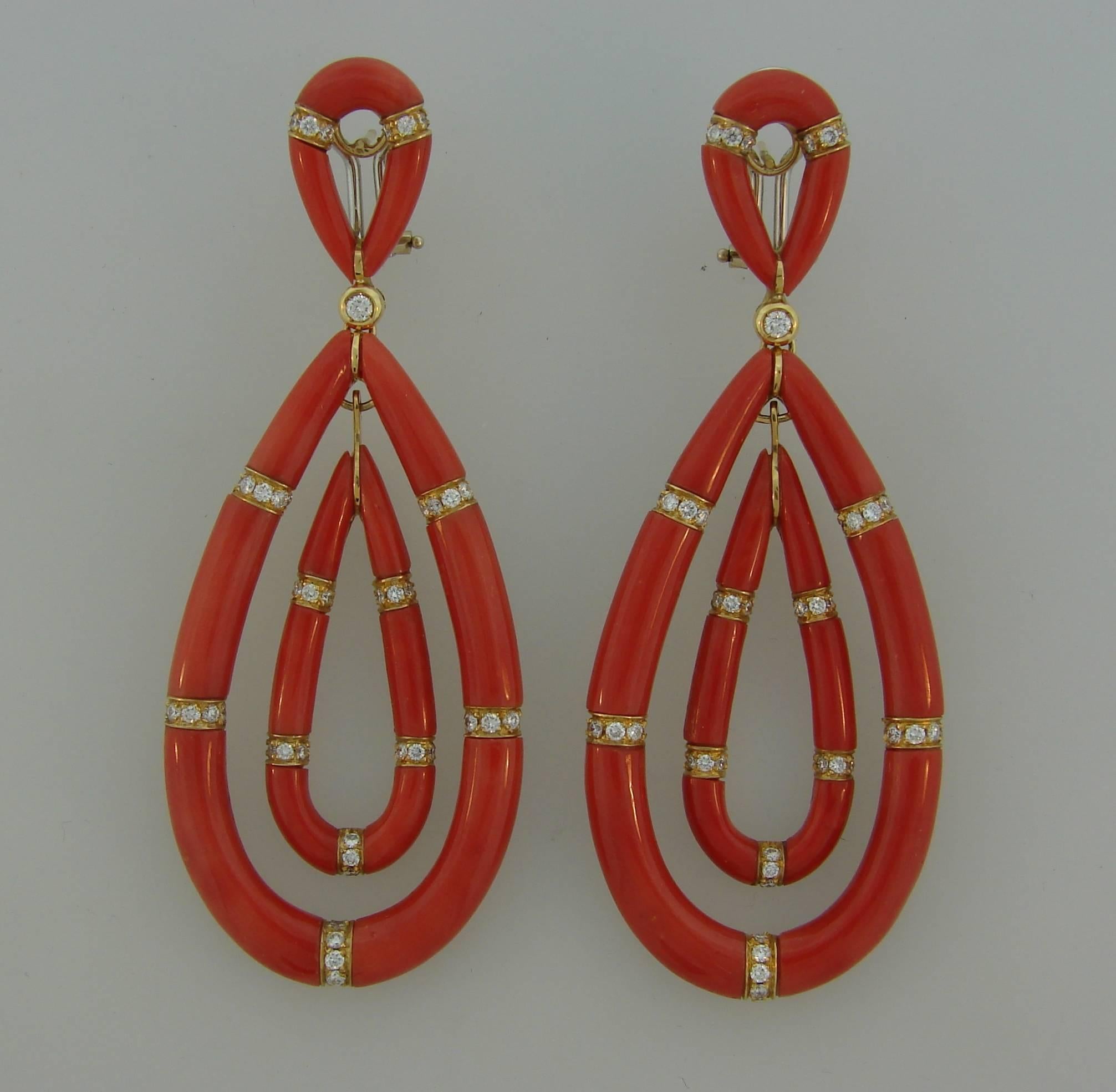 Gorgeous Mediterranean coral earrings created in Italy in the 1970's. Beautiful intense red sprinkled with diamond sparkle, elongated elegant shape will accentuate your refined taste and femininity. The earrings are a great addition to your jewelry