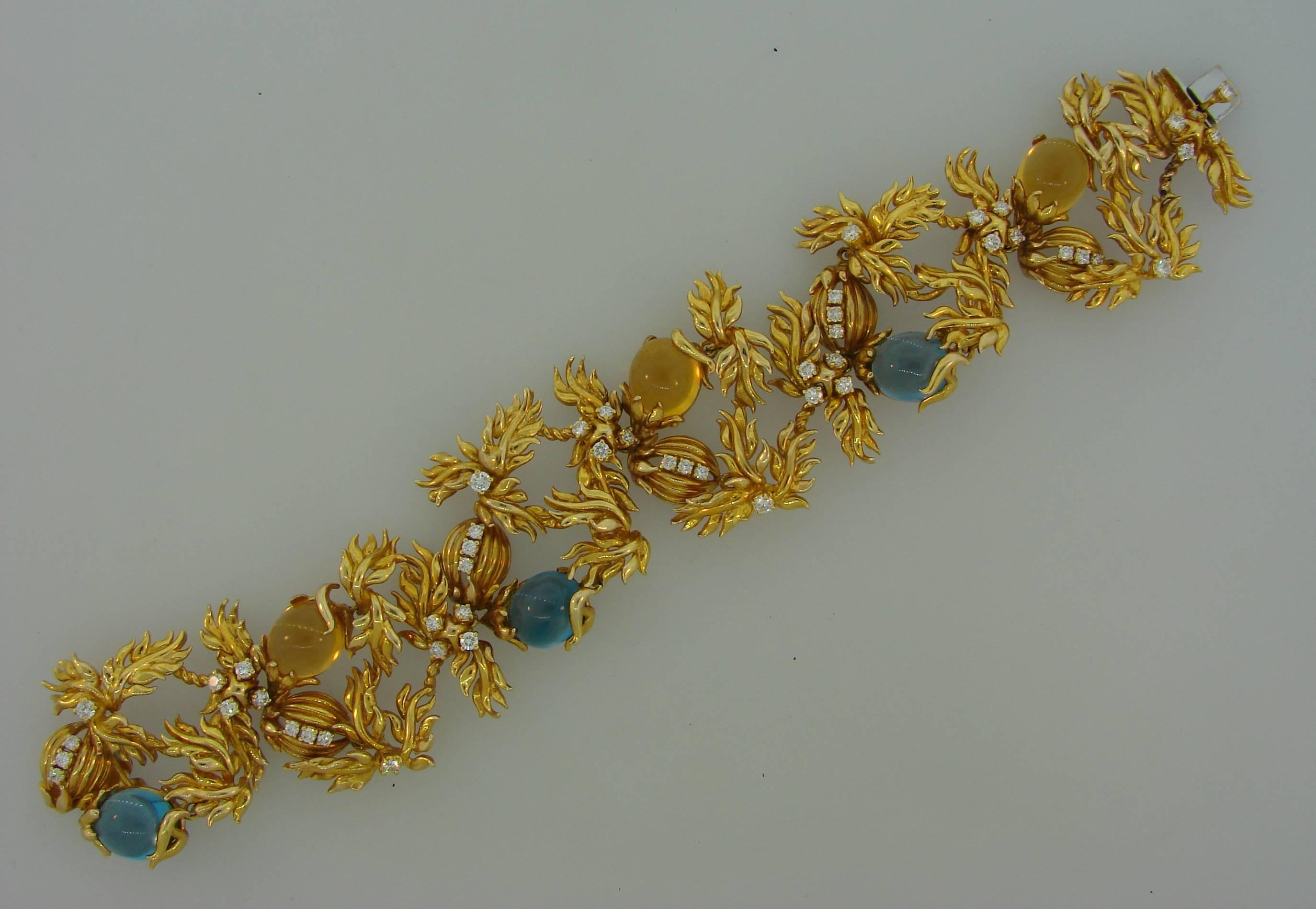Beautiful whimsical bracelet created by Aldo Cipullo for Cartier in the 1980s. Inspired by nature's floral motifs, the bracelet is made of 18 karat yellow gold and set with oval cabochon topaz, citrine and round brilliant cut diamonds. Diamond total