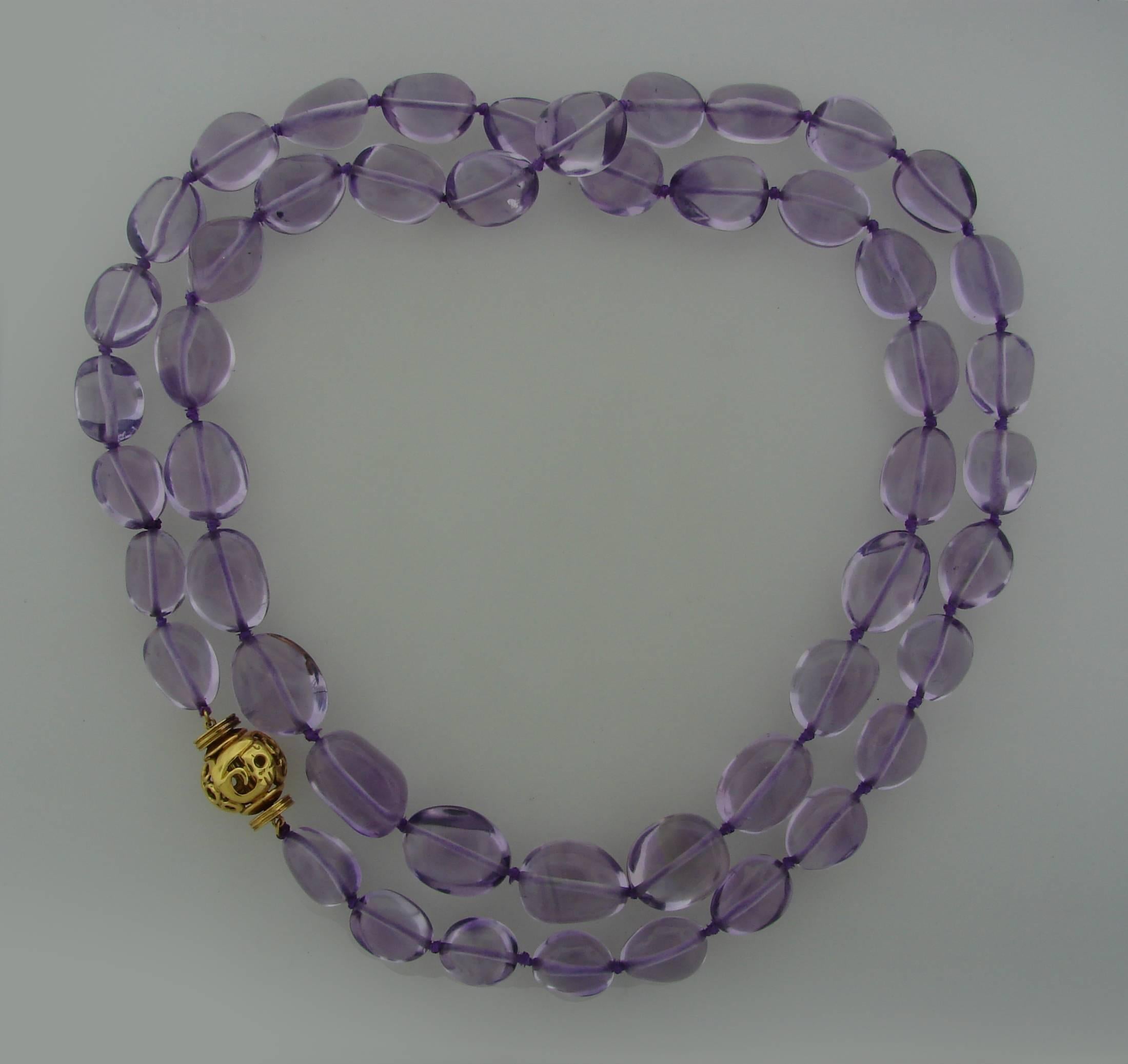 Lovely necklace created by Verdura in the 2000s. Features forty nine graduating amethyst beads. The clasp is made of 18k yellow gold. Beautiful combination of purple amethyst and shiny yellow gold will accentuate your refined taste and style and