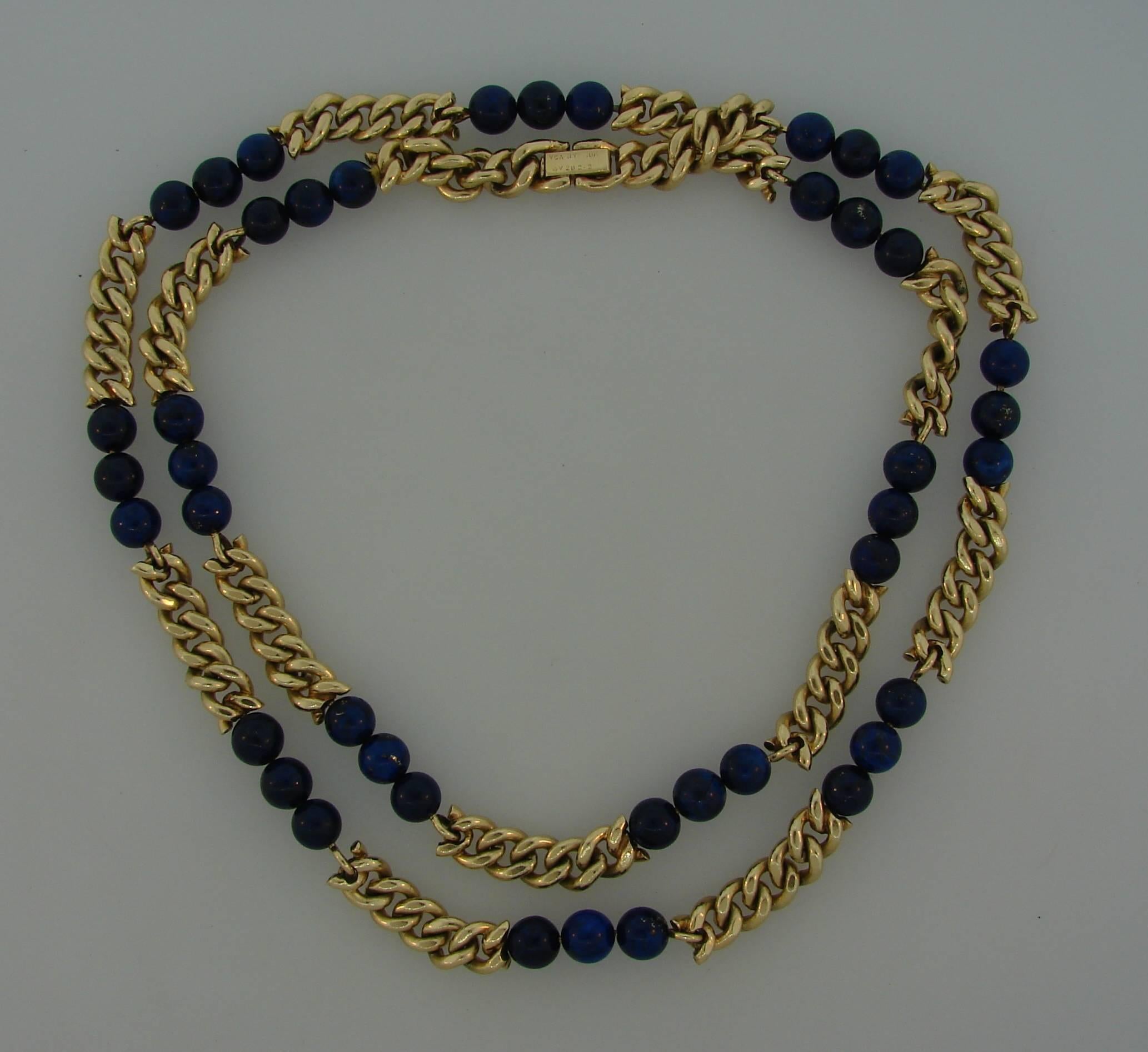 Nice and wearable necklace created by Van Cleef & Arpels in New York in the 1970s. 
Made of 14 karat (stamped) yellow gold and lapis lazuli beads, the clasp marked 18 karat.  The necklace is 30 inches (76 cm) long, 1/4 inch (0.7 cm) wide and weighs