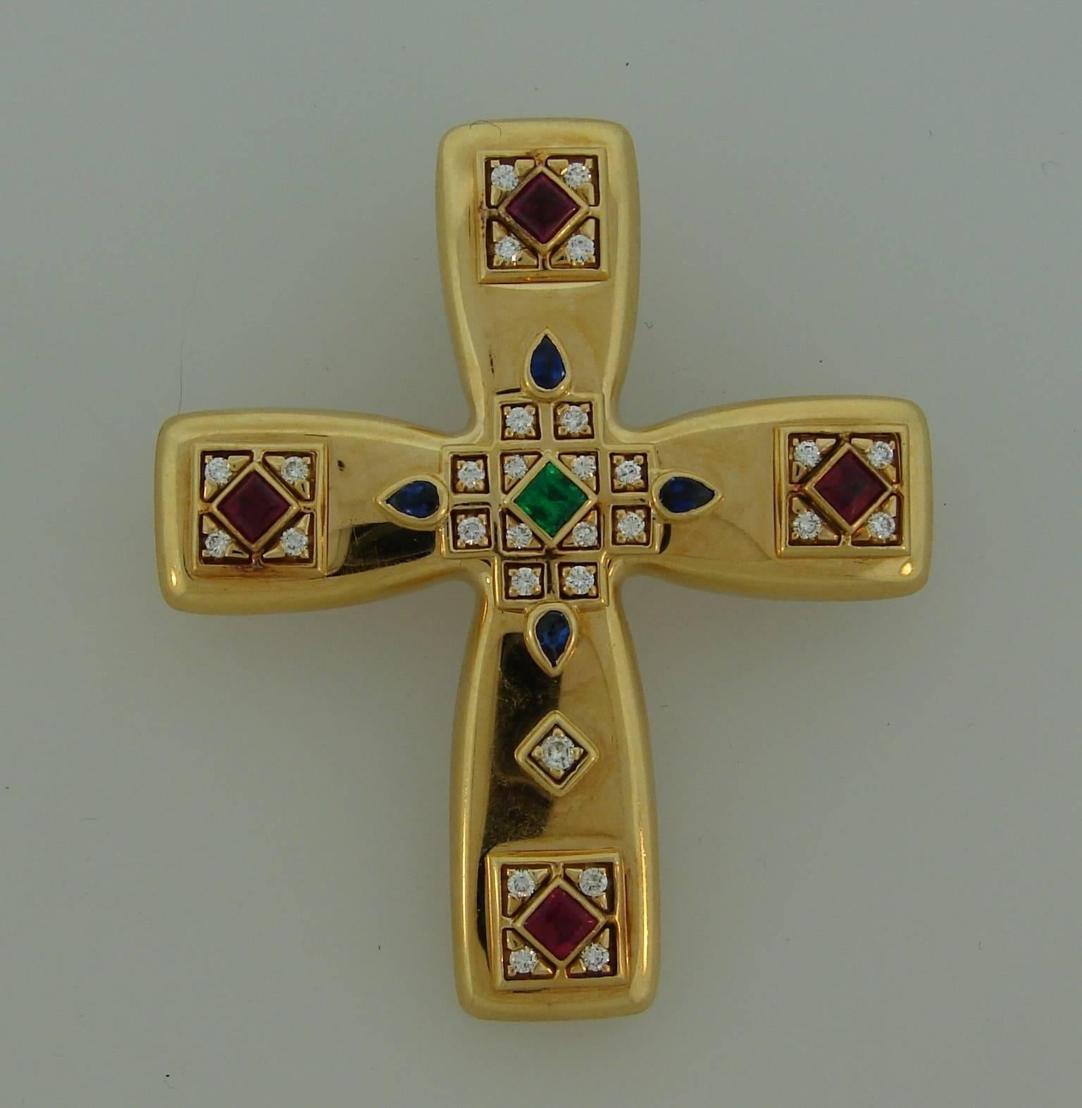 Beautiful cross clip/pendant created by Cartier in 1993. Its Byzantine motif inspired Louis Cartier during his trip to Russia in the beginning of the 20th century to create his St. Petersburg jewelry collection. Colorful and chic, the cross is a
