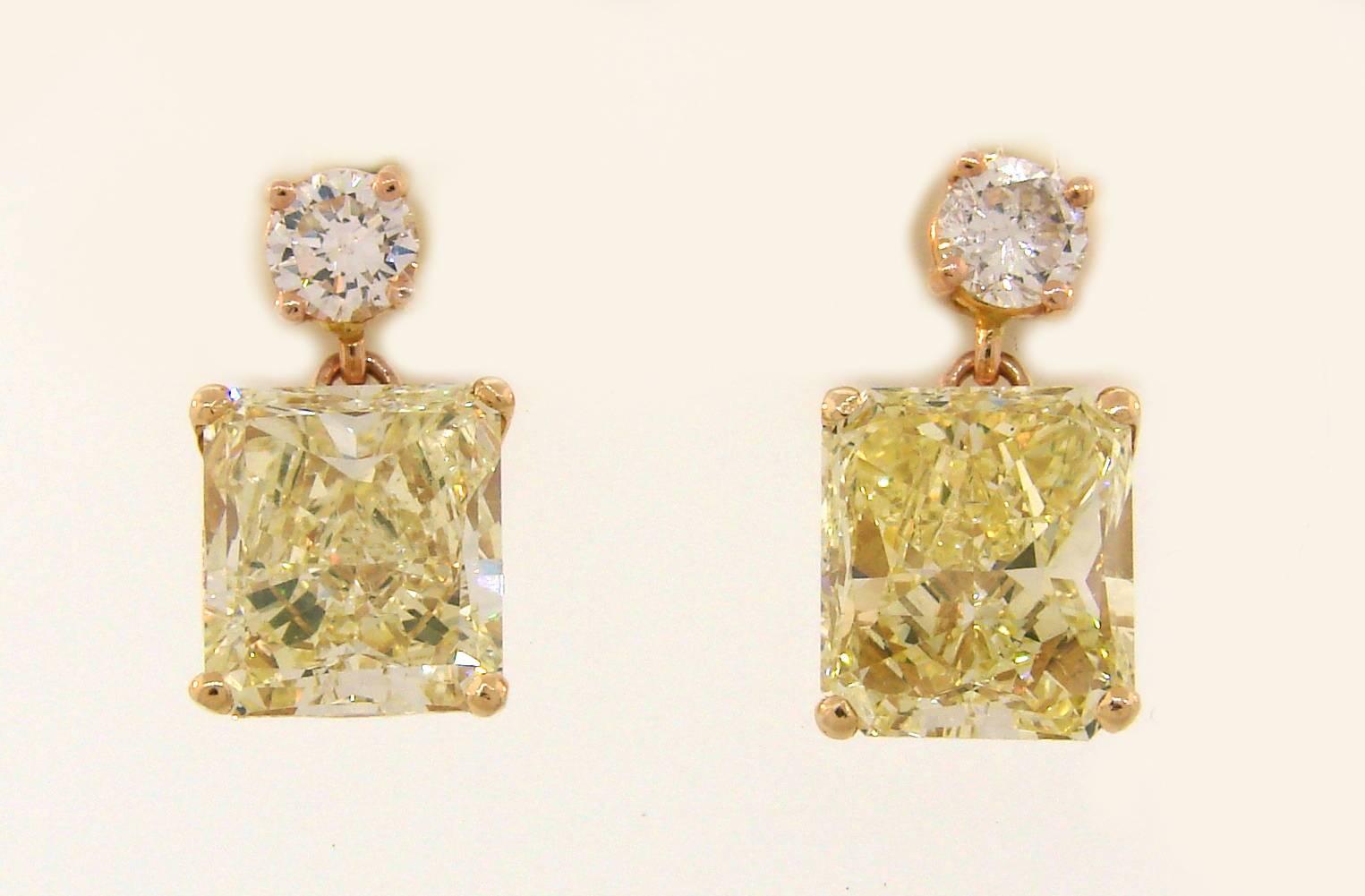 Classic and timeless two-stone earrings that are a great addition to your jewelry collection. They are made of 18 karat (tested) rose gold and feature two rectangular modified brilliant cut fancy yellow diamonds. Each diamond comes with a GIA