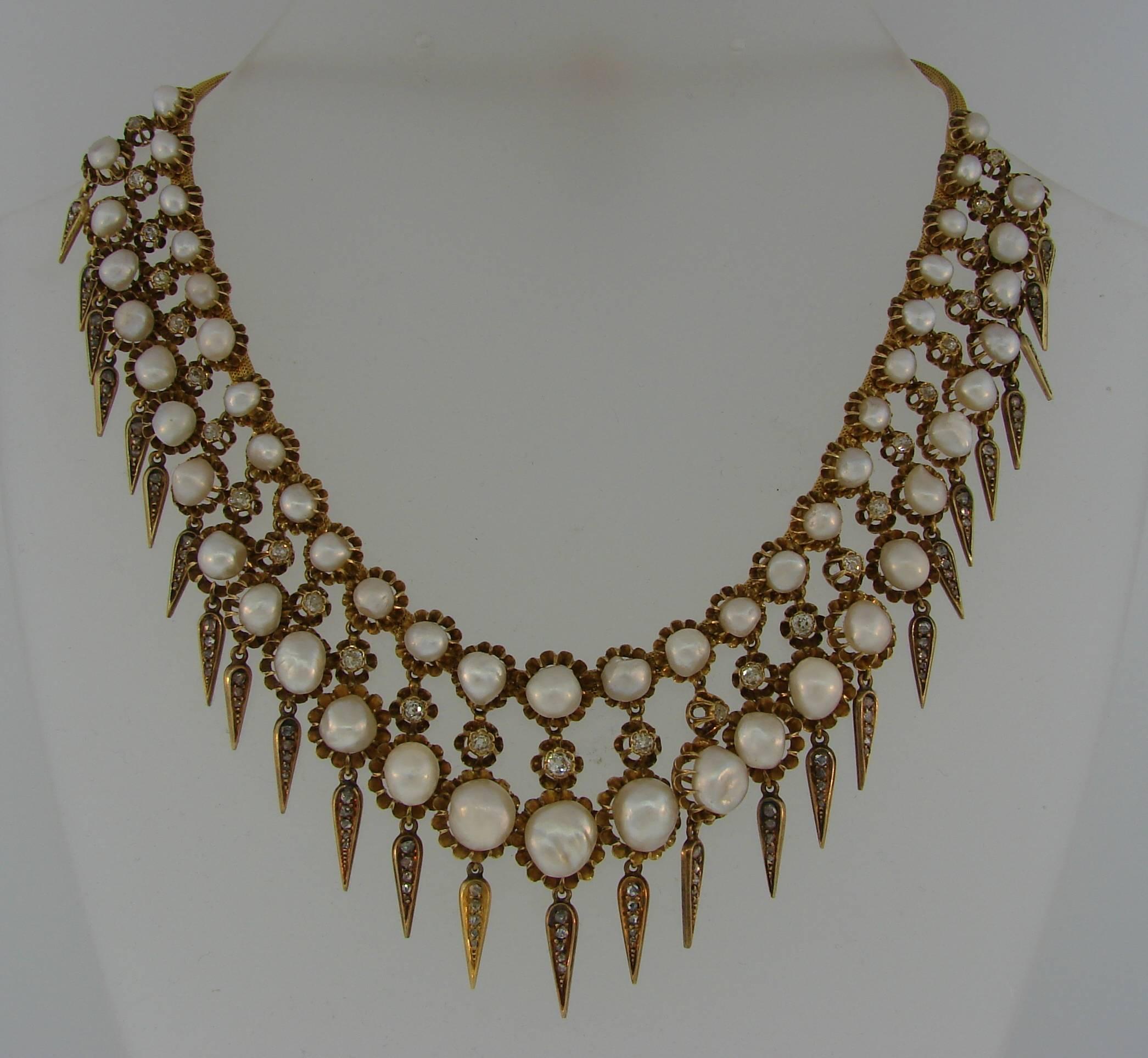 Stunning Victorian necklace created on the turn of 20th century. Elegant and chic, it is a great addition to your jewelry collection.
The necklace features fifty six natural pearls set in 18 karat (tested) yellow gold and encrusted with Old