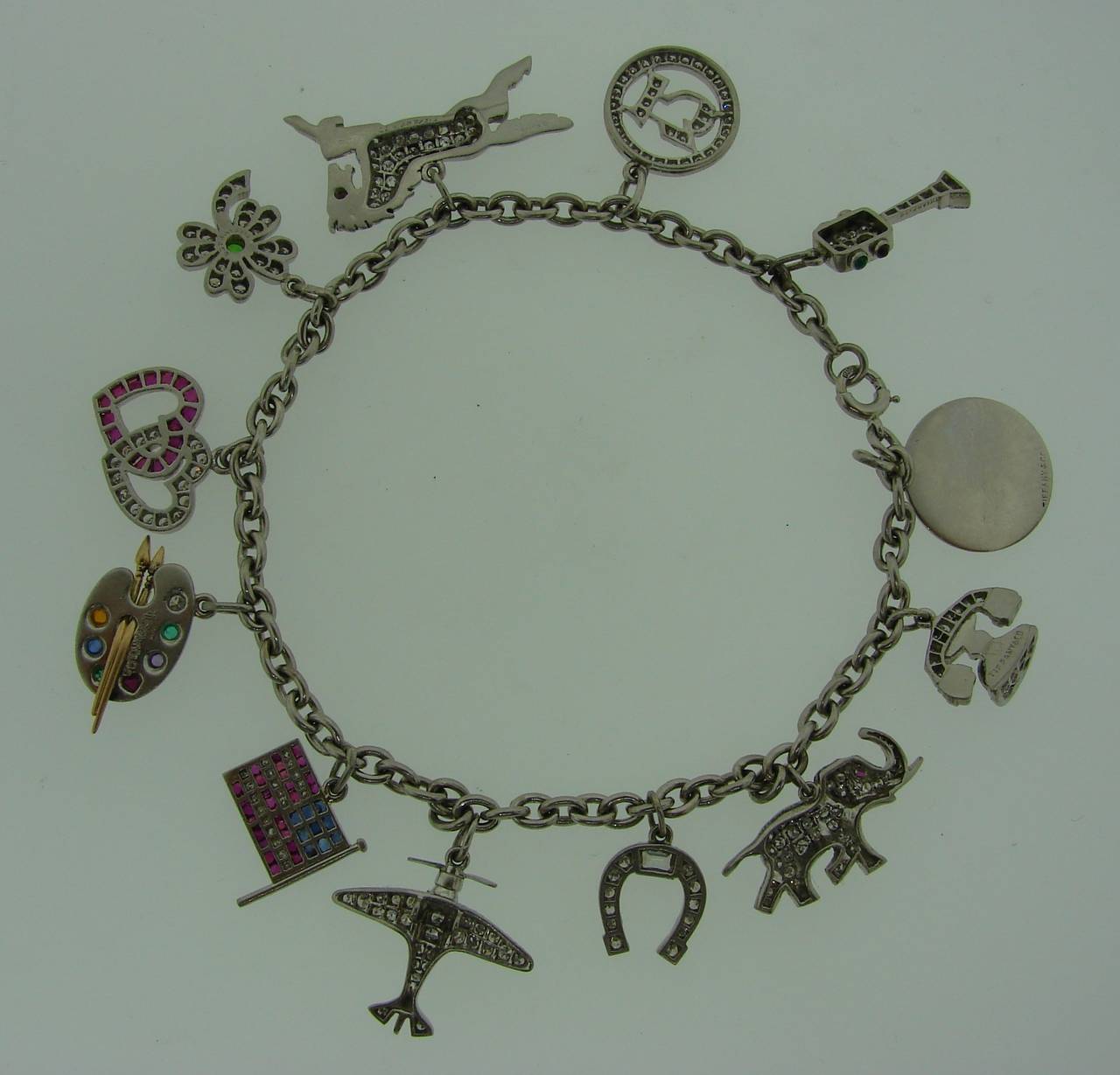 1920s Tiffany & Co. Art Deco Gems and Platinum Charm Bracelet In Excellent Condition In Beverly Hills, CA