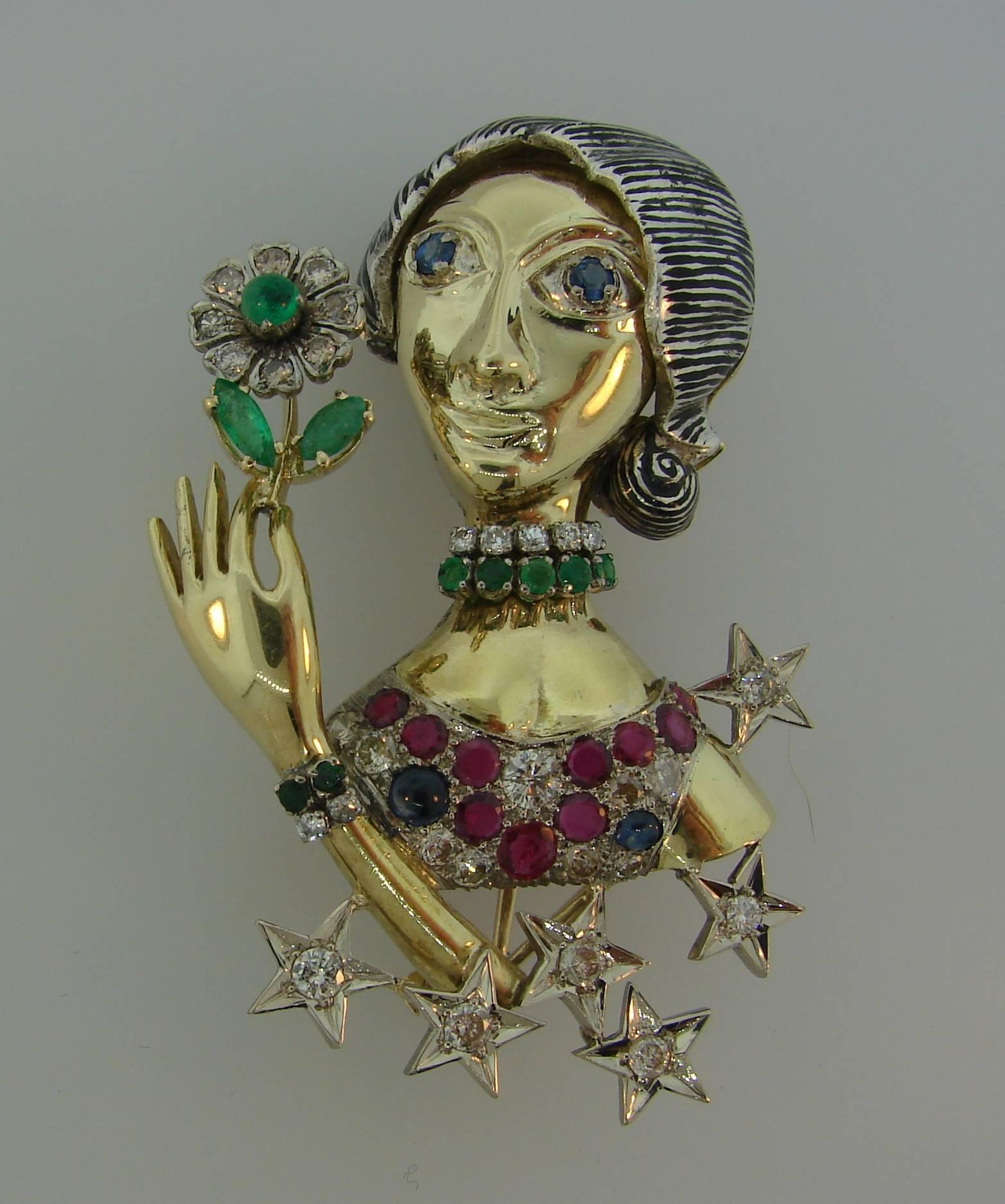 Fun and chic pin depicting a jeweled woman with a flower - definitely a conversational piece! Wearable and cute, the brooch is a great addition to your jewelry collection. 
Made of 14 karat (tested) yellow and white gold and encrusted with diamonds,