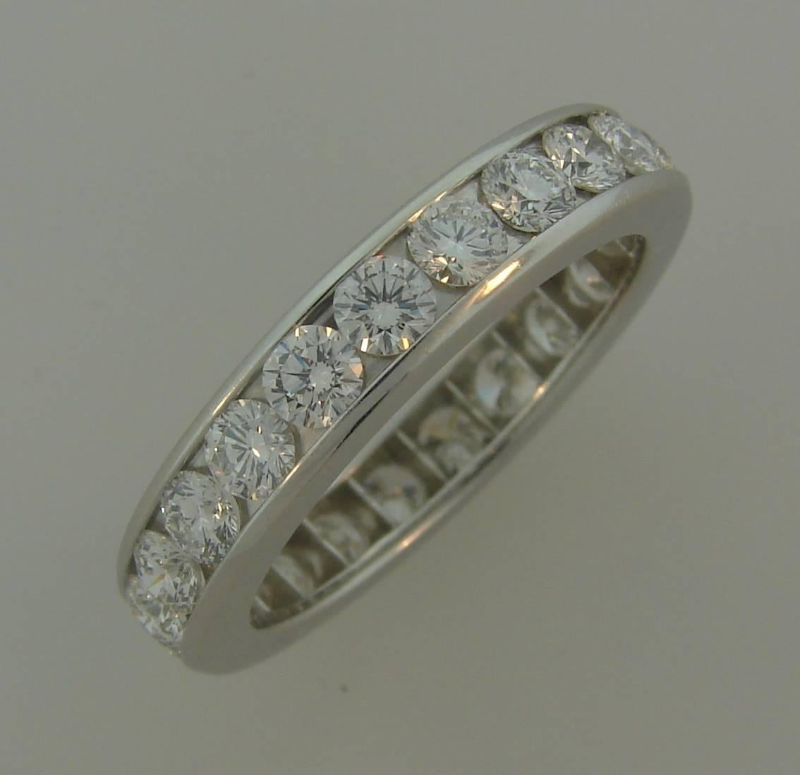  Classy and timeless diamond eternity band created by Tiffany & Co. 
Made of platinum and set with twenty three round brilliant cut diamonds approximately 0.10-carat each. Diamonds are F-G color VVS2 clarity, total weight approximately 2.30 carats.
