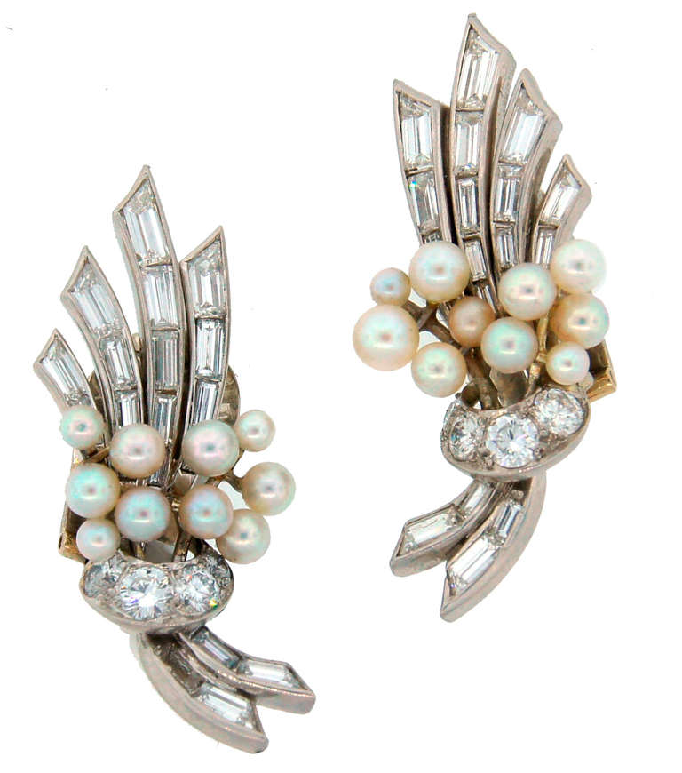 Fabulous earrings created by Van Cleef & Arpels, New York in the 1930's. Feminine, understated and chic. Wearable - casual/upper casual - depending on occasion. Tasteful combination of diamonds, pearls and platinum. The earrings are clip-on, posts