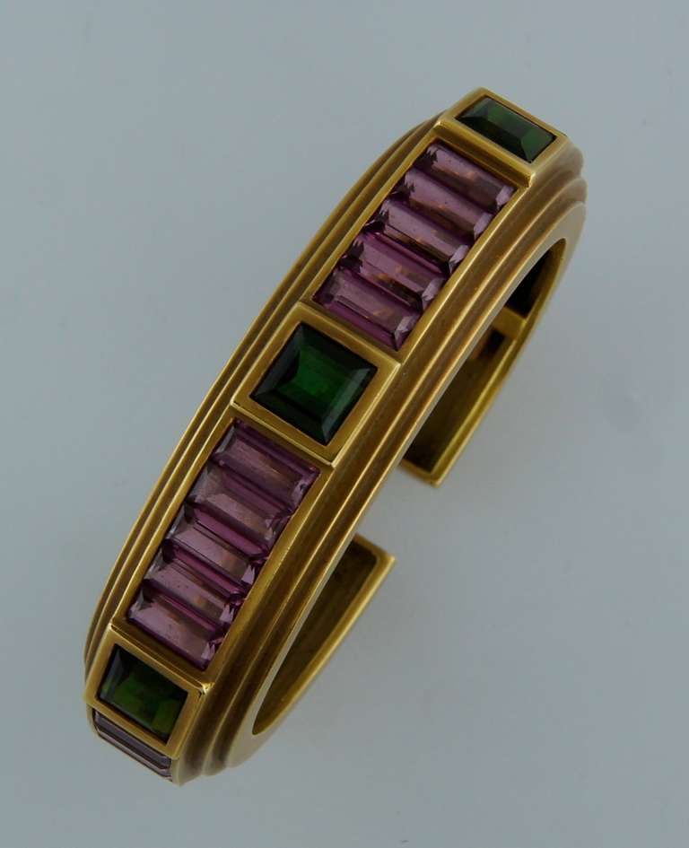 Bold and colorful bracelet. Nice and heavy. Geometrical and three-dimensional. Tasteful combination of signature Kieselstein-Cord greenish gold with pink and green tourmaline. Created in 1989. Signed and hallmarked for 18k gold. Perfectly fits up to