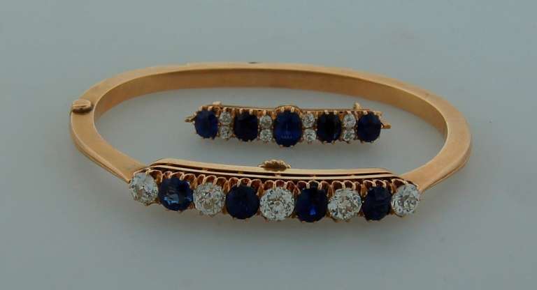 Beautiful Imperial Russian antique set consisting of a bangle and a pin in the original fitted box. Features finest old Russian diamonds and sapphires set in yellow gold. The set was made by a goldsmith with initials 