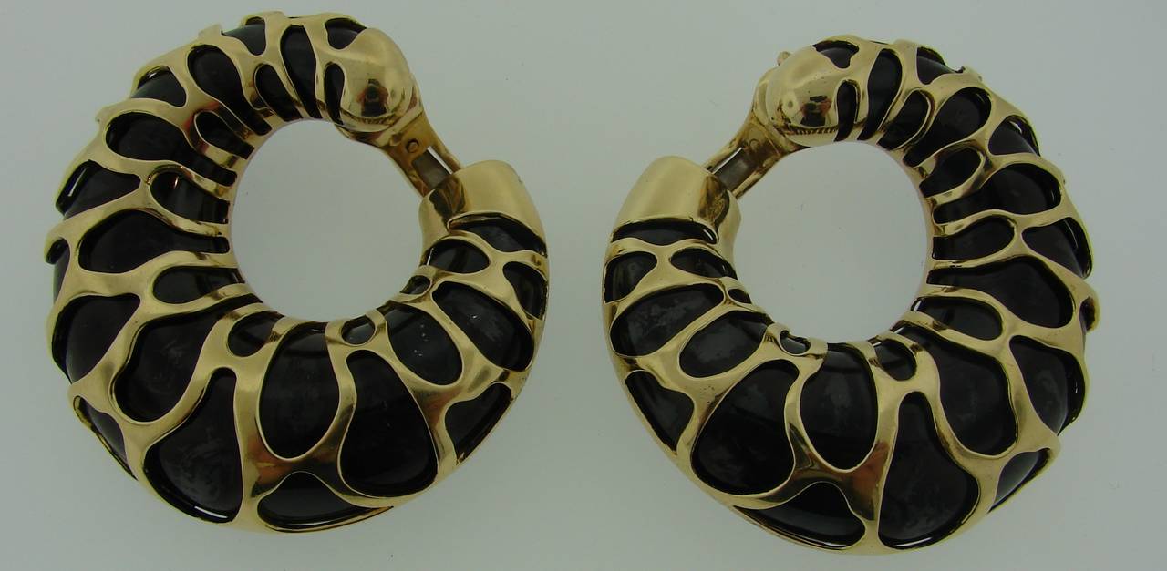 Bold yet elegant hoop earrings created by Marina B in Italy in the 1989. Unusual combination of blackened metal and 18k yellow gold, giraffe motif pattern and voluminosity are the highlights of these stunning earrings. 

They measure 1-7/8