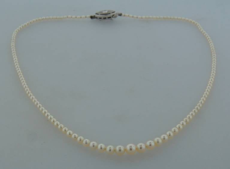 Tiffany & Co. Natural Pearl Necklace with Diamond and Platinum Clasp In Excellent Condition In Beverly Hills, CA