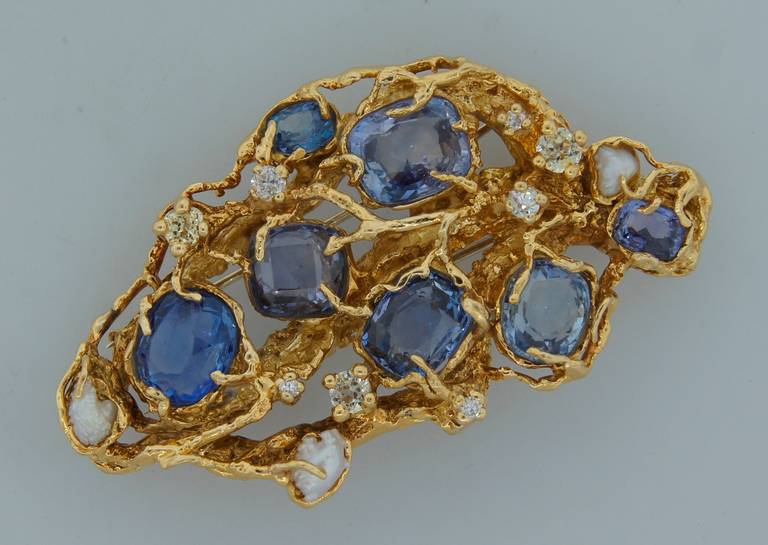 Whimsical detailed brooch created by Arthur King in the 1960's. He was known for using lost wax casting technique to set baroque pearls, raw gems and colored diamonds in naturalistic forms. His style is often emulated, but rarely equaled. Made of