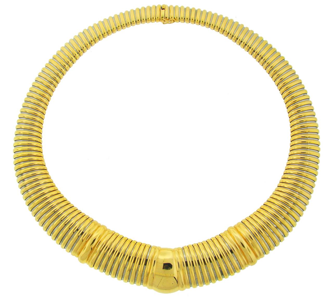 Stunning tubogas necklace created by Cartier in the 1980's. Made of 18k yellow gold and stainless steel. Elegant, stylish piece. Chic and wearable.
The necklace is 18