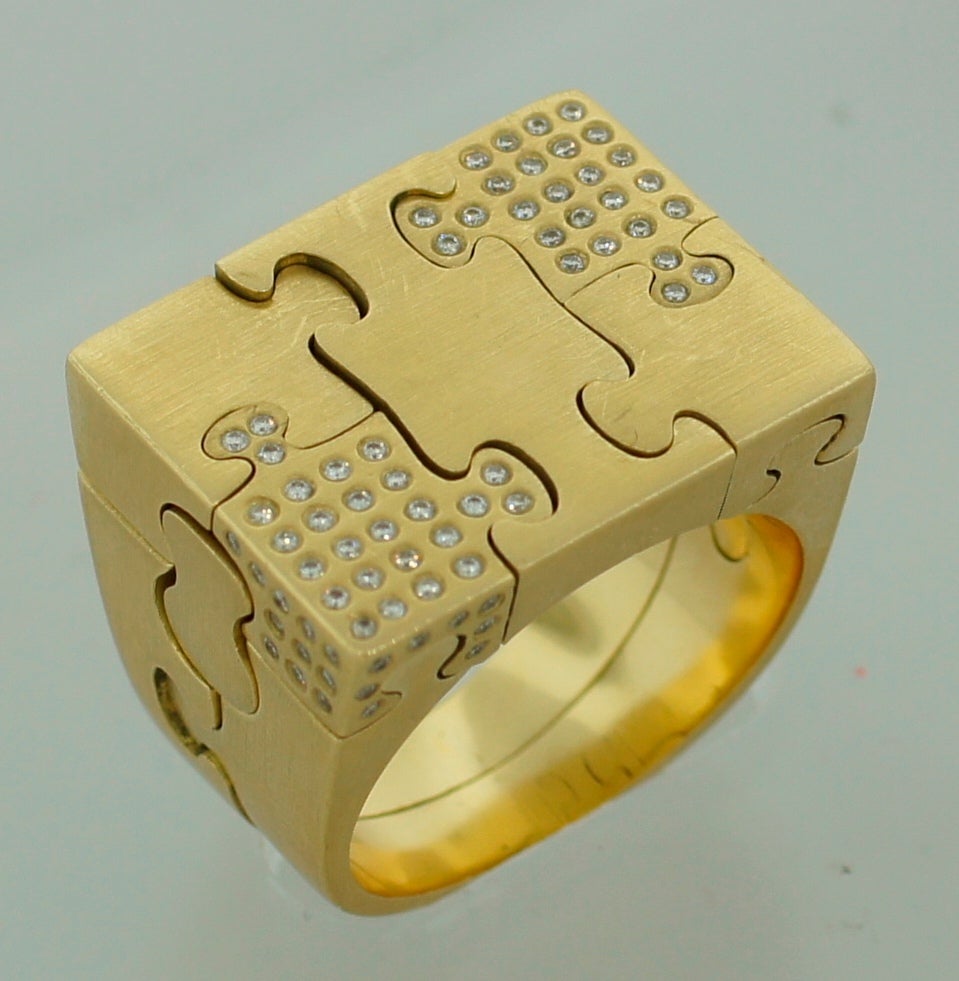 Famous Puzzle ring that invites its wearer to play with it. The ring was created by Antonio Bernardo, initially trained as an engineer who later found his passion in jewelry. That's why Bernardo's pieces impress not only with their playful lightness