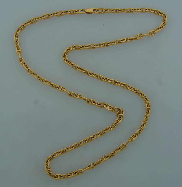 Chic nautical motif yellow gold necklace created by Hermes in the 1980's. Interchangeable - it comes apart and makes a short necklace and a bracelet.
Chic, simple, understated, elegant! 
1/8