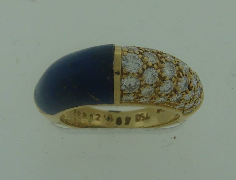Chic and colorful cocktail ring created by Cartier in Paris in the 1970's. Tasteful combination of deep blue lapis lazuli, sparkling white diamonds and yellow gold!
18k yellow gold, diamond total weight 0.75 carat.
Size 4.5.
The ring is 0.25