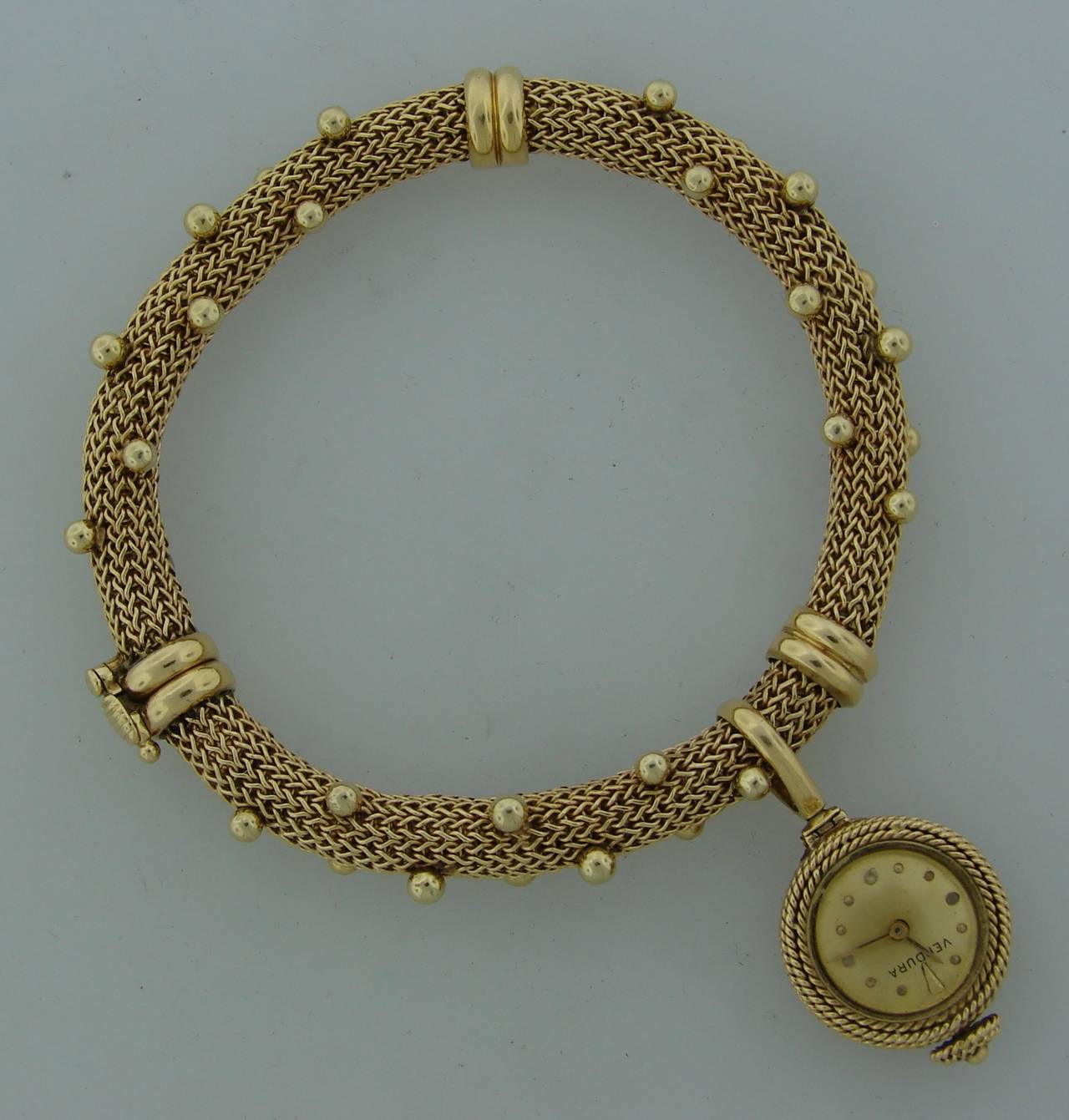 A signature Verdura piece - a prototype of well-known Beehive pendant watch. Created in the 1960's. Made of 18k yellow gold.
The bracelet fits up to 7.25