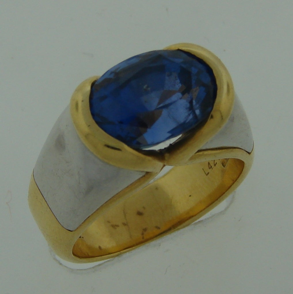 Bold and colorful cocktail ring created by Marina B in Italy in the 1980s. Features an oval 6.83-ct sapphire set in 18k yellow and white gold.Sapphire has a gorgeous purplish blue color!
The ring is size 6.75-7 and can be re-sized if needed.