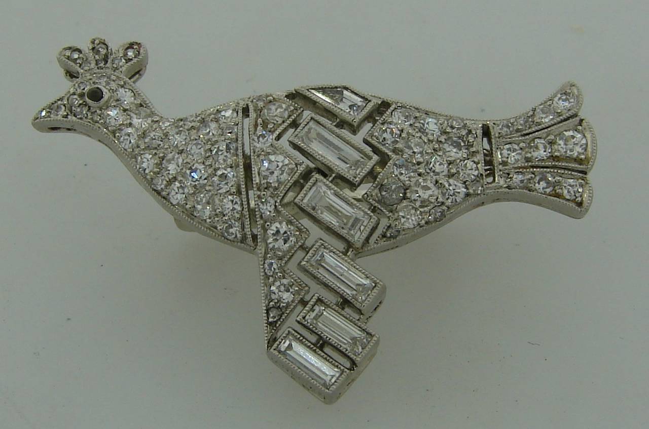 Chic elegant enhancer/clasp that is designed to keep two strands together. Created by  Janesich in the 1920's. It is made of platinum and set with single cut and baguette cut diamonds - total weight 1.24 carats. 
Gorgeous, elegant, feminine