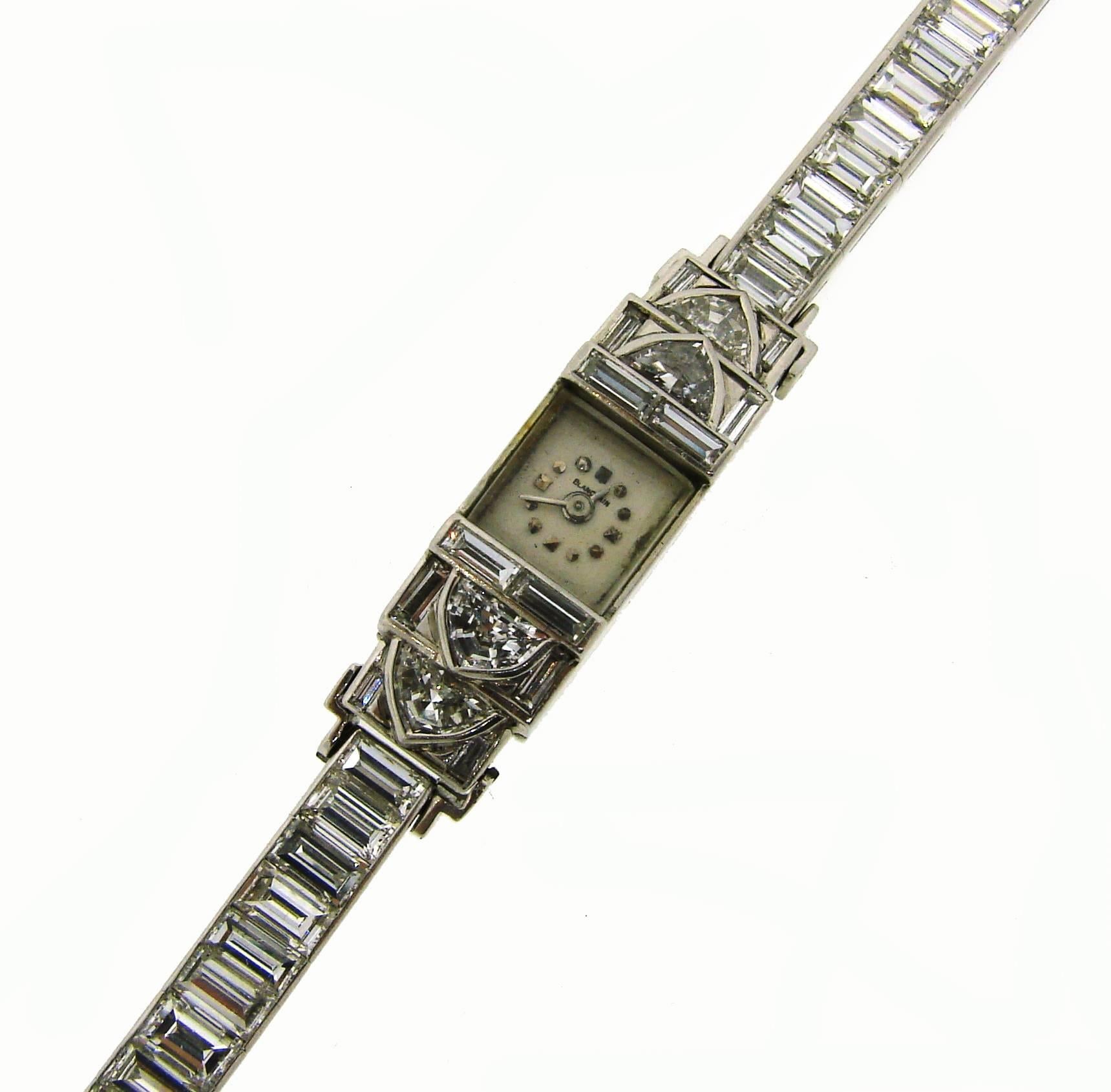 Beautiful, classy, elegant and timeless dressy Art Deco watch / bracelet that is a great addition to your jewelry collection. Created by Blancpain in the 1930's. It is made of platinum (tested) and set with approximately 14 carats of step cut and