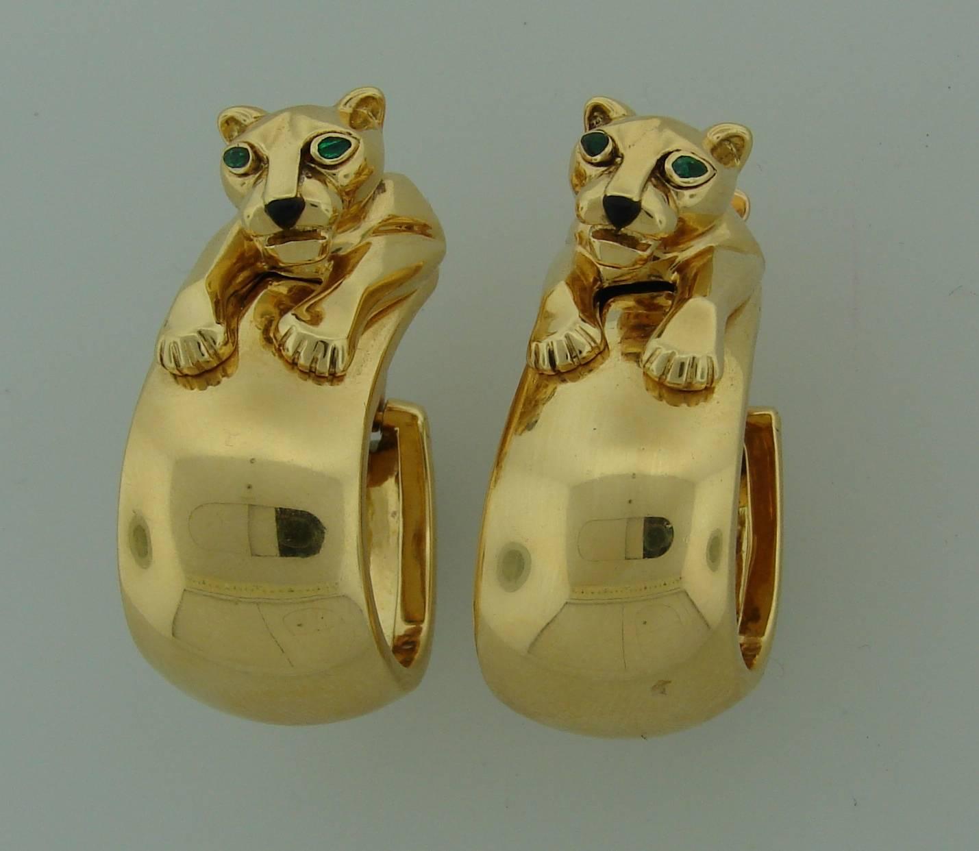 Signature Cartier Panthere Collection earrings. Made of 18k yellow gold, the panther's eyes are made of emerald, the nose - of black onyx. Cartier do not make this particular model anymore which makes them desirable and collectable.
The earrings
