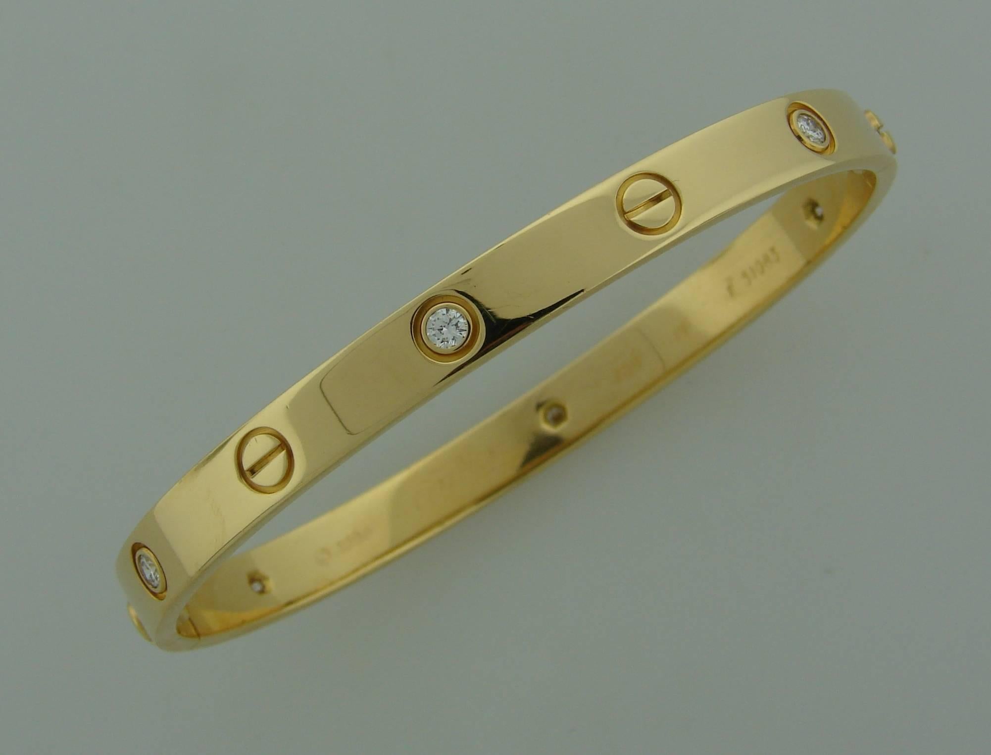 Cult Cartier Love bracelet made in 1998 of 18k yellow gold and set with six round brilliant cut diamonds (total wight 0.60 carat). Size 19. 
The bracelet comes with the original box and screw-driver. 
It is stamped with Cartier maker's mark,