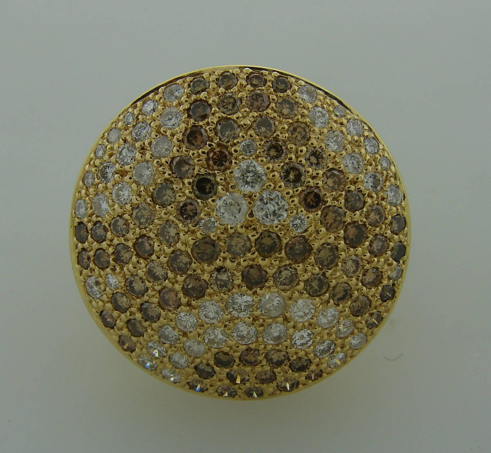 Exquisite cocktail ring created by Cartier in 1999. Jeton Sauvage Collection. Made of 18k yellow gold and set with 52 white and 68 cognac round brilliant cut diamonds. Total weight of the white diamonds  is approximately 0.53 carat and total weight