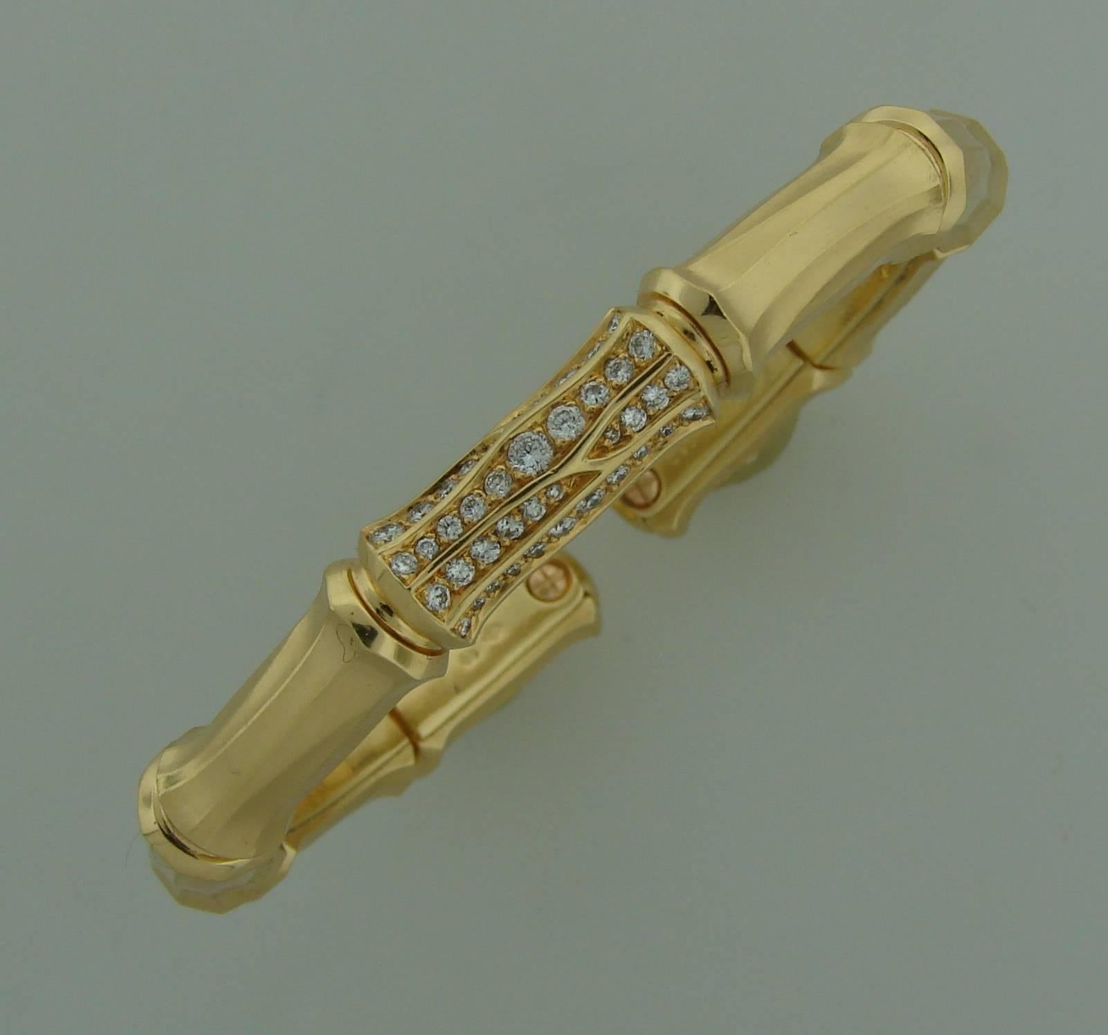 Chic bracelet created by Cartier in France for famous "Bamboo" collection. Made of 18k yellow gold and encrusted with round brilliant cut diamonds in the center. Diamond total weight is approximately 1 carat.
Fits up to 6.25" wrist.