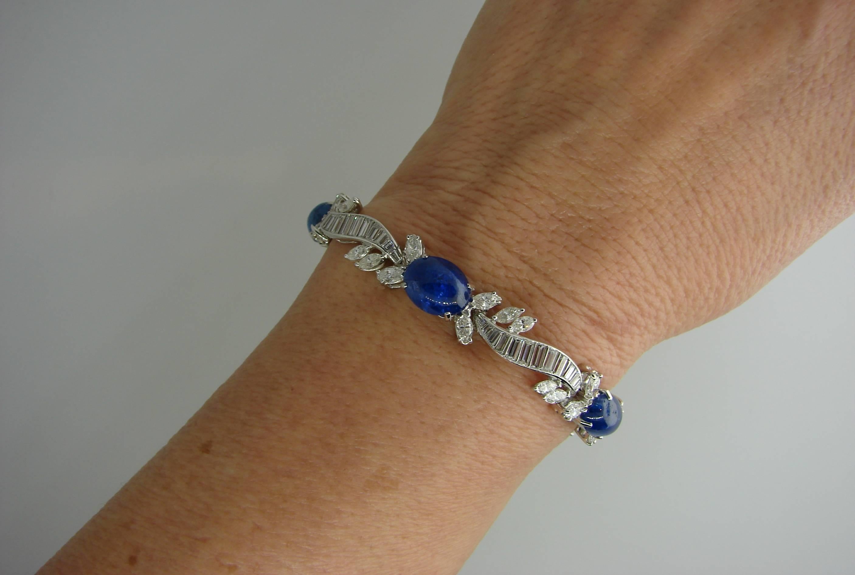Magnificent classy and elegant bracelet created by Van Cleef & Arpels in the 1960's. Features five cabochon sapphires and multiple baguette cut and marquise cut diamonds set in platinum.
Fits up to 6.5" - 7" wrist.
The sapphires are
